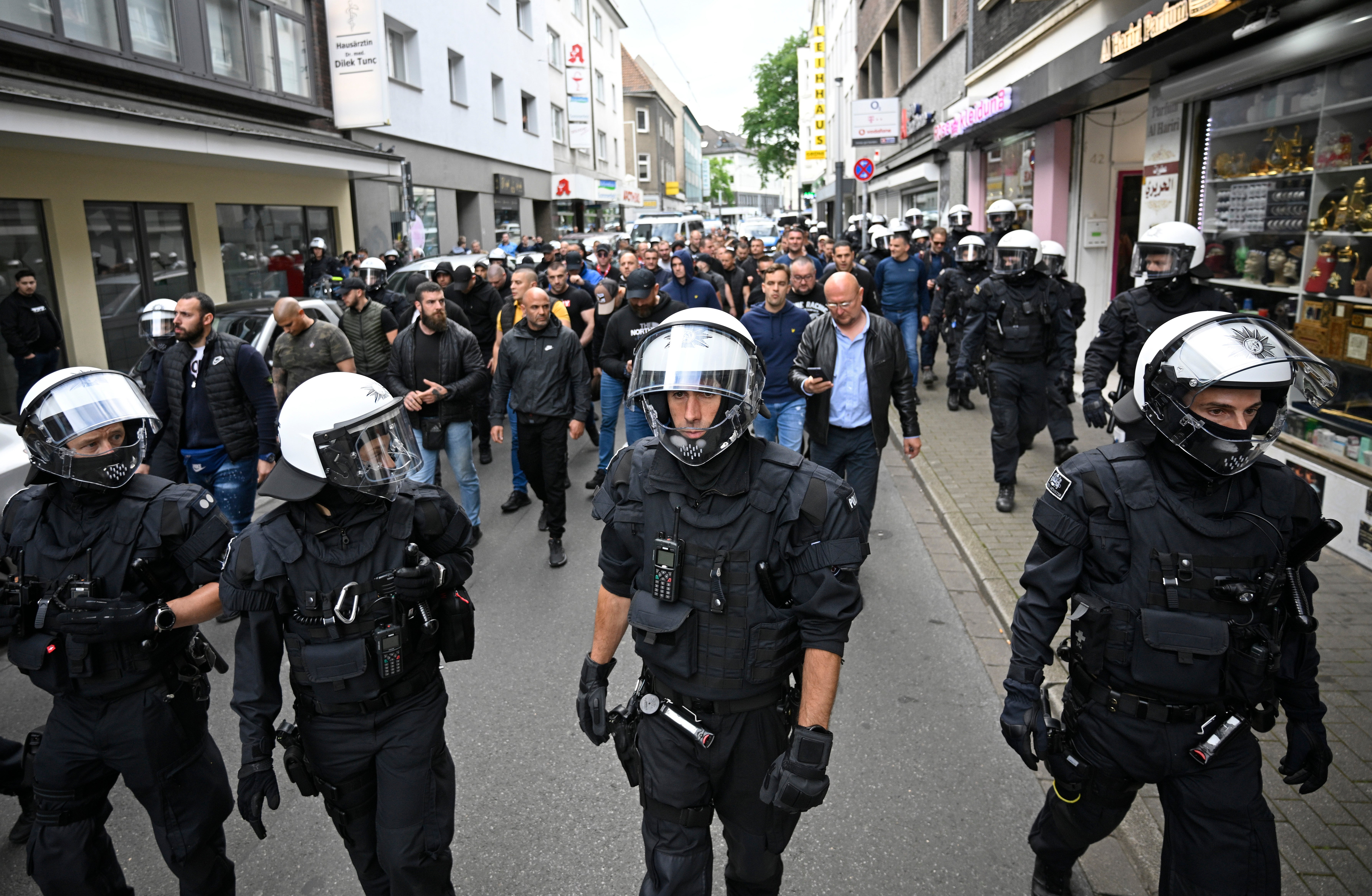 Police escort Serbia fans en route to the Euro 2024 game against England