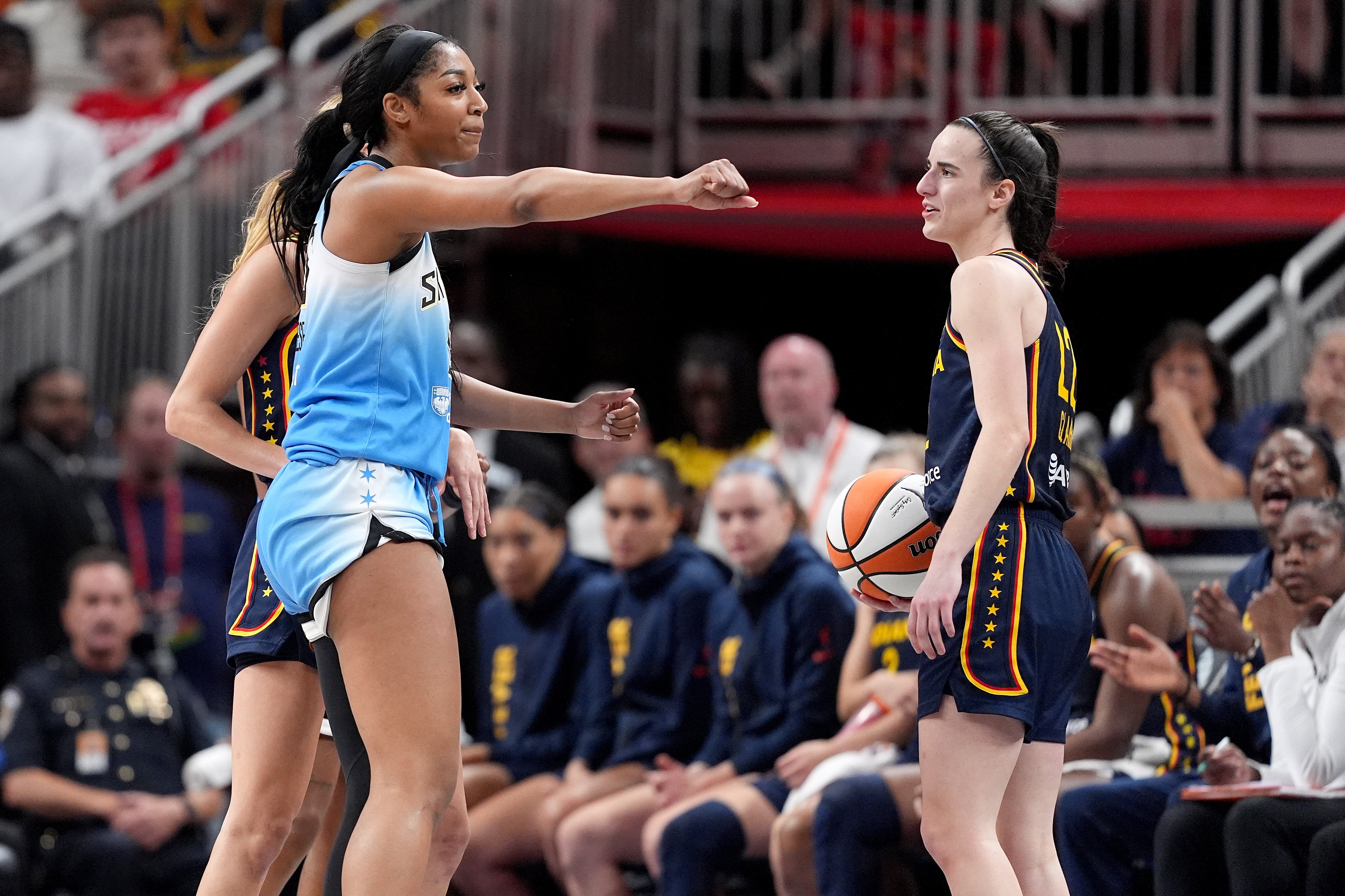 The rivalry between WNBA stars Caitlin Clark and Angel Reese fired up again on Sunday after another on-court dust-up where Reese hit Clark on the head during a foul