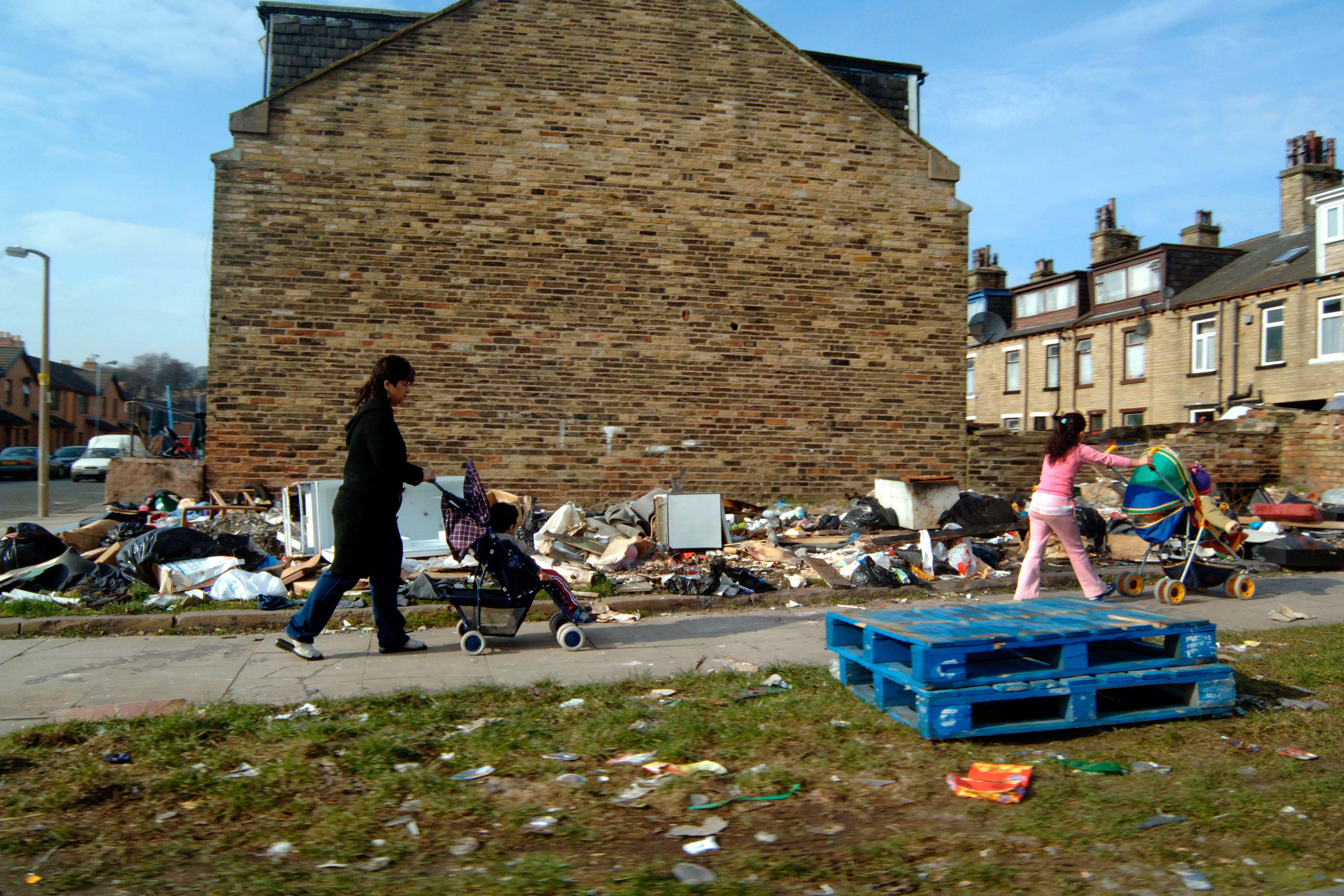 The study suggests the cap has driven up the share of children in large families who are in relative poverty (Alamy/PA)