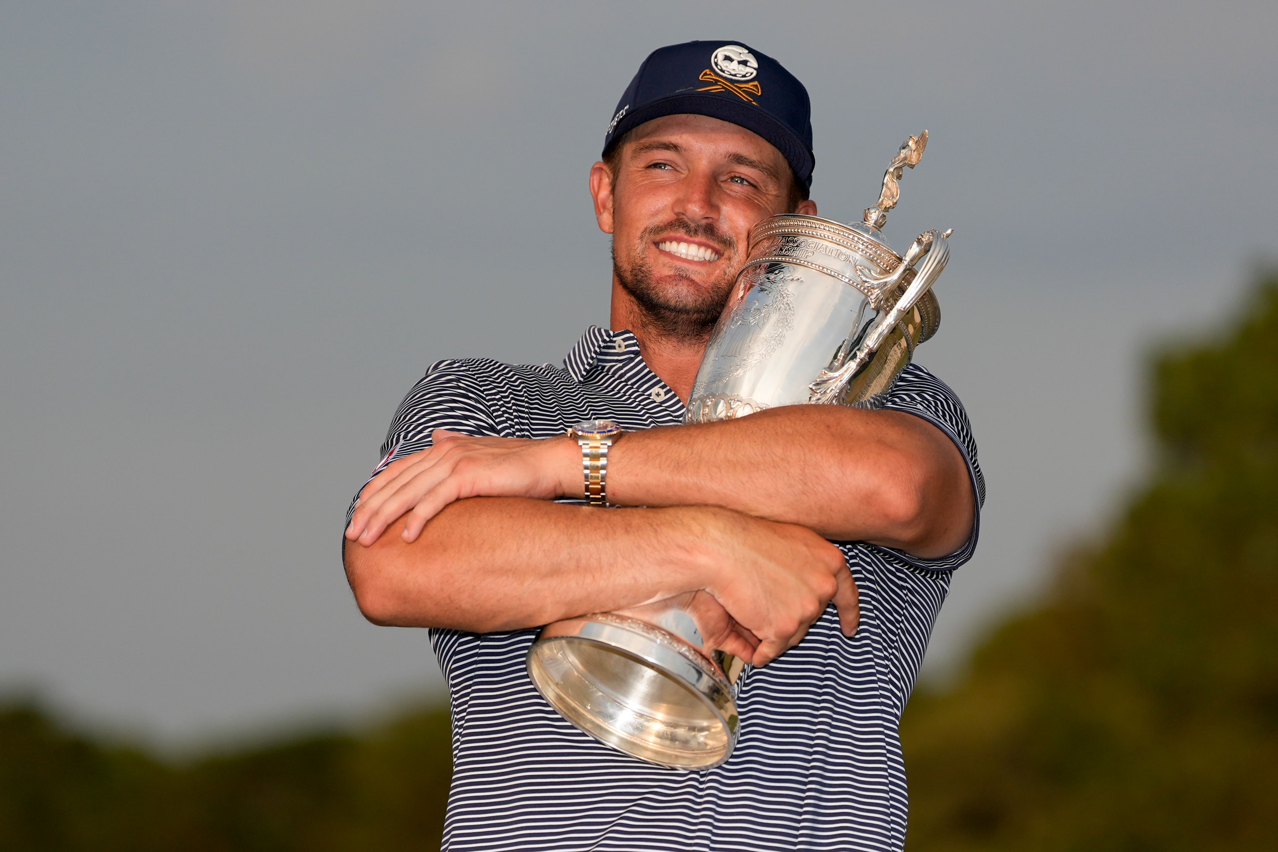 Bryson DeChambeau holds the trophy after winning the US Open at Pinehurst