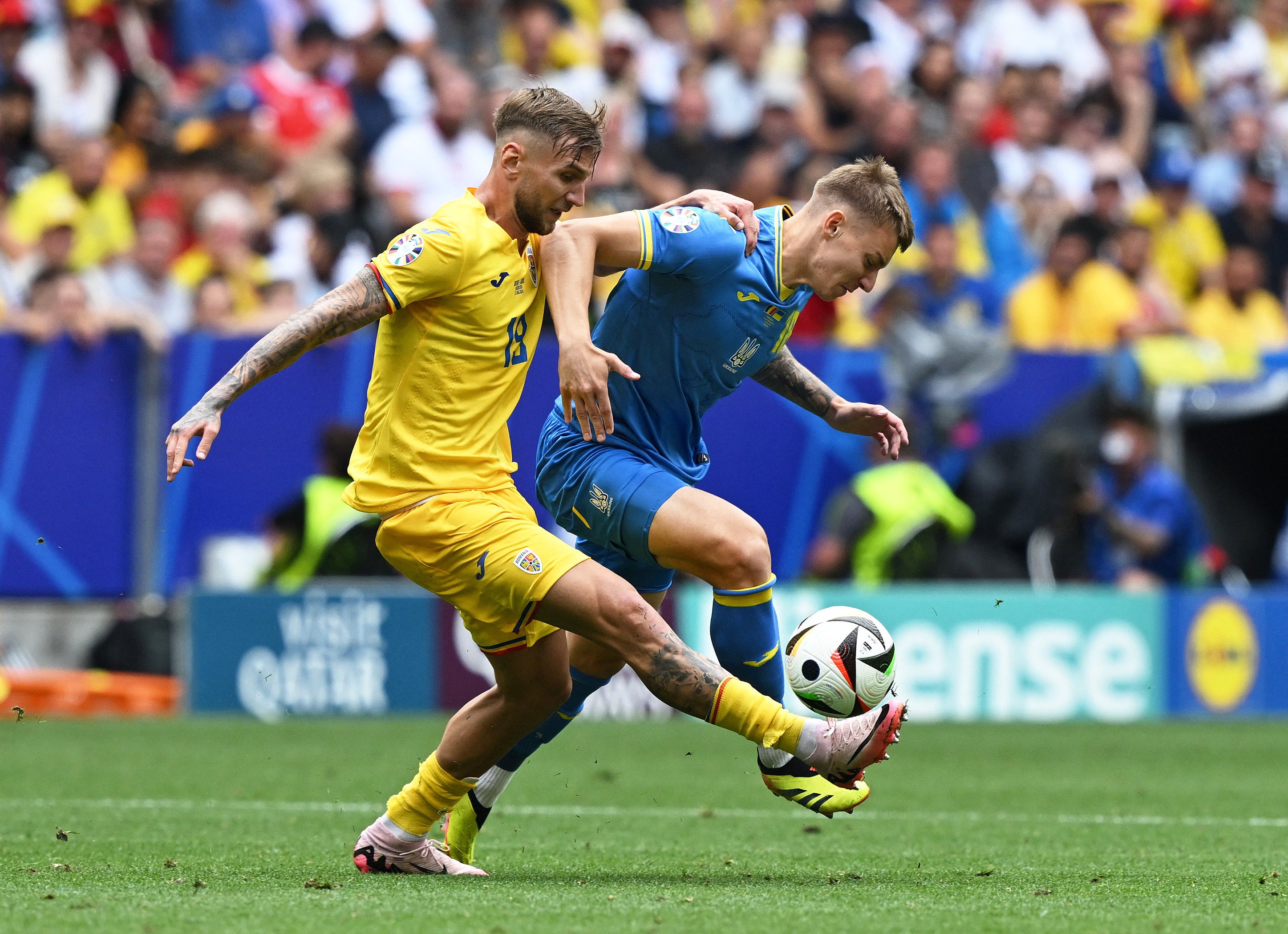 Romania’s Denis Dragus in action with Ukraine’s Volodymyr Brazhko