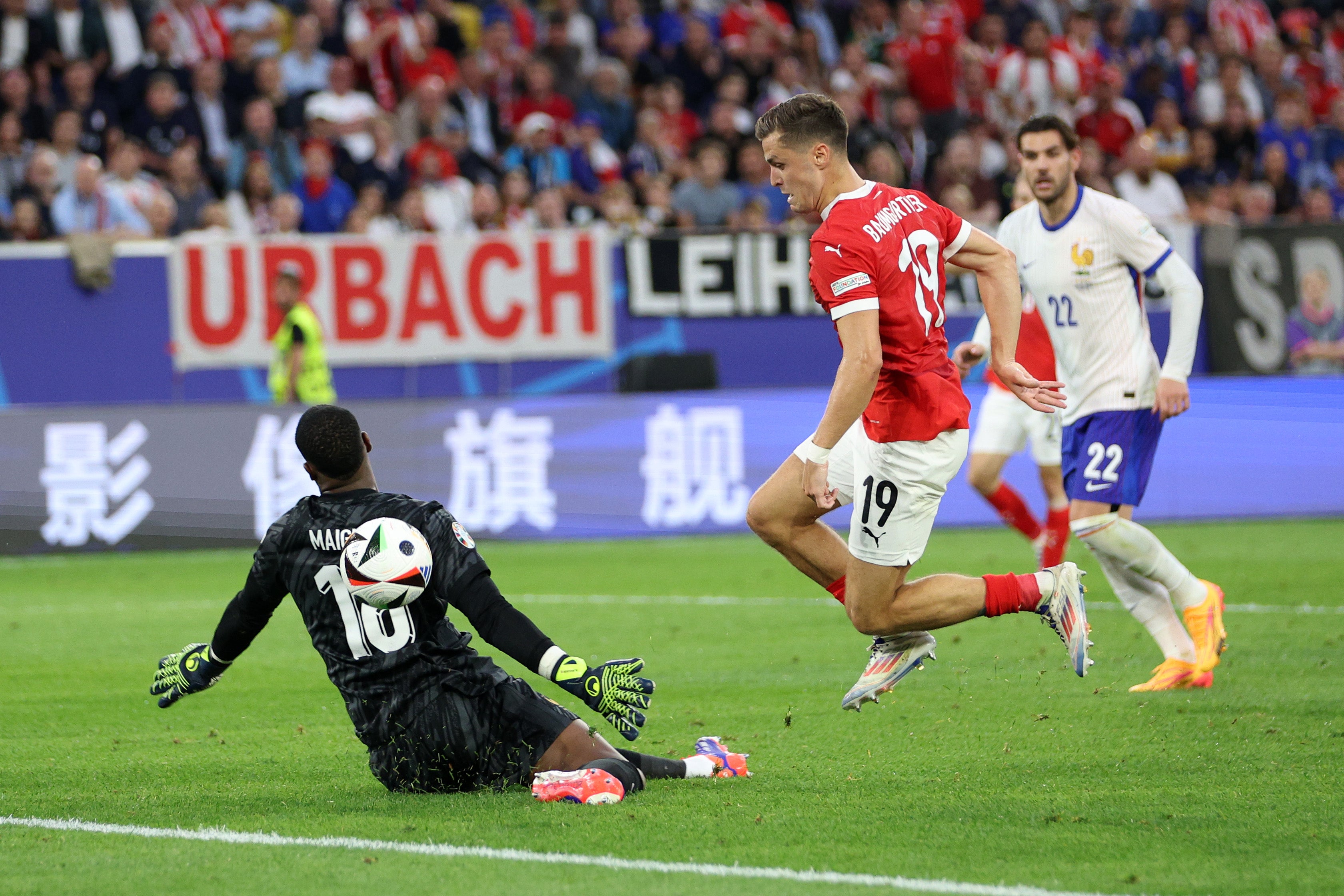 Christoph Baumgartner is denied by France goalkeeper Mike Maignan