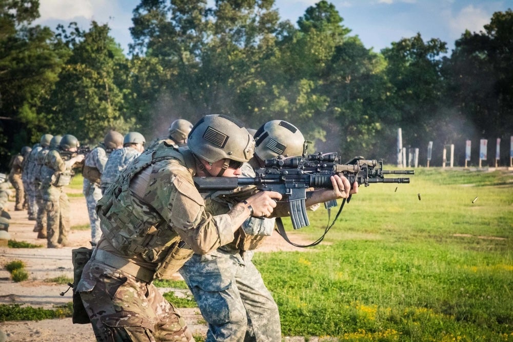 A US Army infantryman assigned to Foxtrot Company ‘Pathfinders’ 2nd Assault Helicopter Battalion, 82nd Combat Aviation Brigade, looks through his sights during M4 rifle reflexive fire range training at Fort Bragg, North Carolina