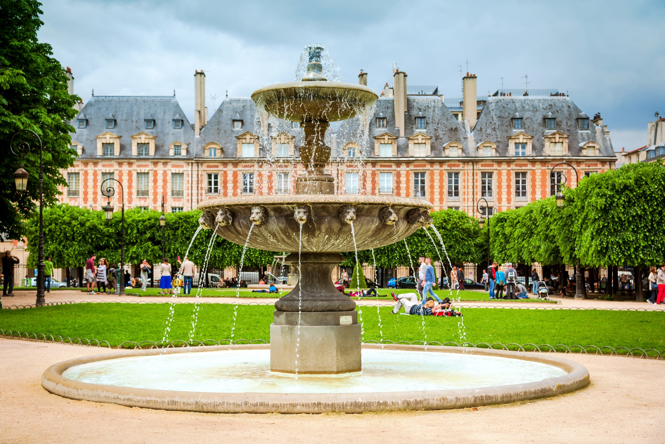 Stroll around La Place des Vosges, one of the oldest squares in Paris