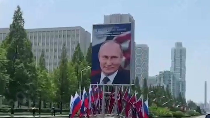 Portraits of Putin and Russian flags line streets in Pyongyang ahead of his arrival