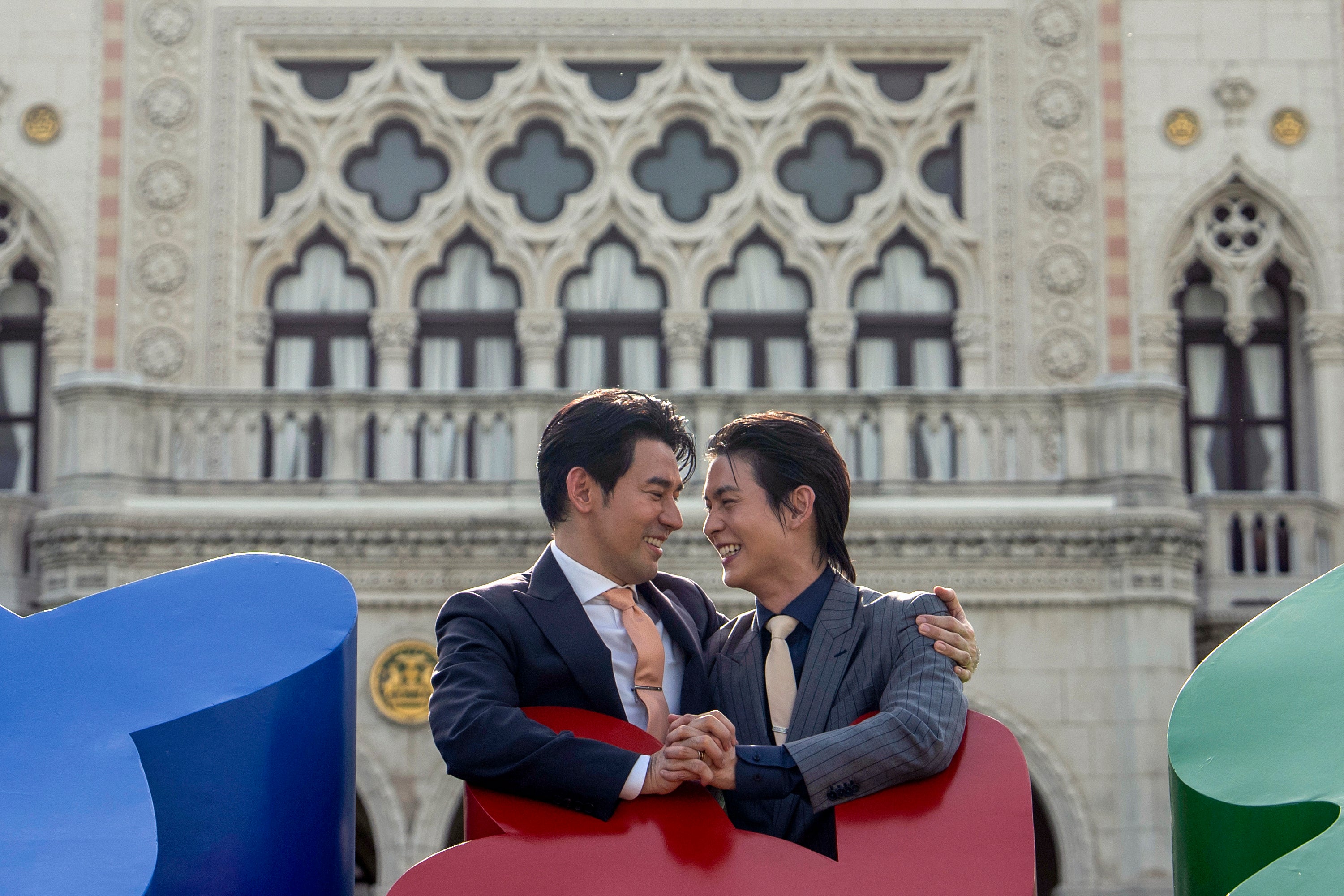 Members of the LGBTQ community celebrate after the Thai parliament passed the final senatorial vote on the same-sex marriage bill at Government House in Bangkok