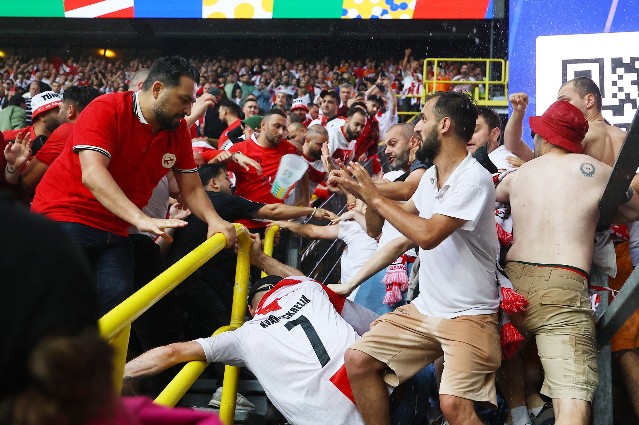 Turkey and Georgia fans fight in the stands before kick-off