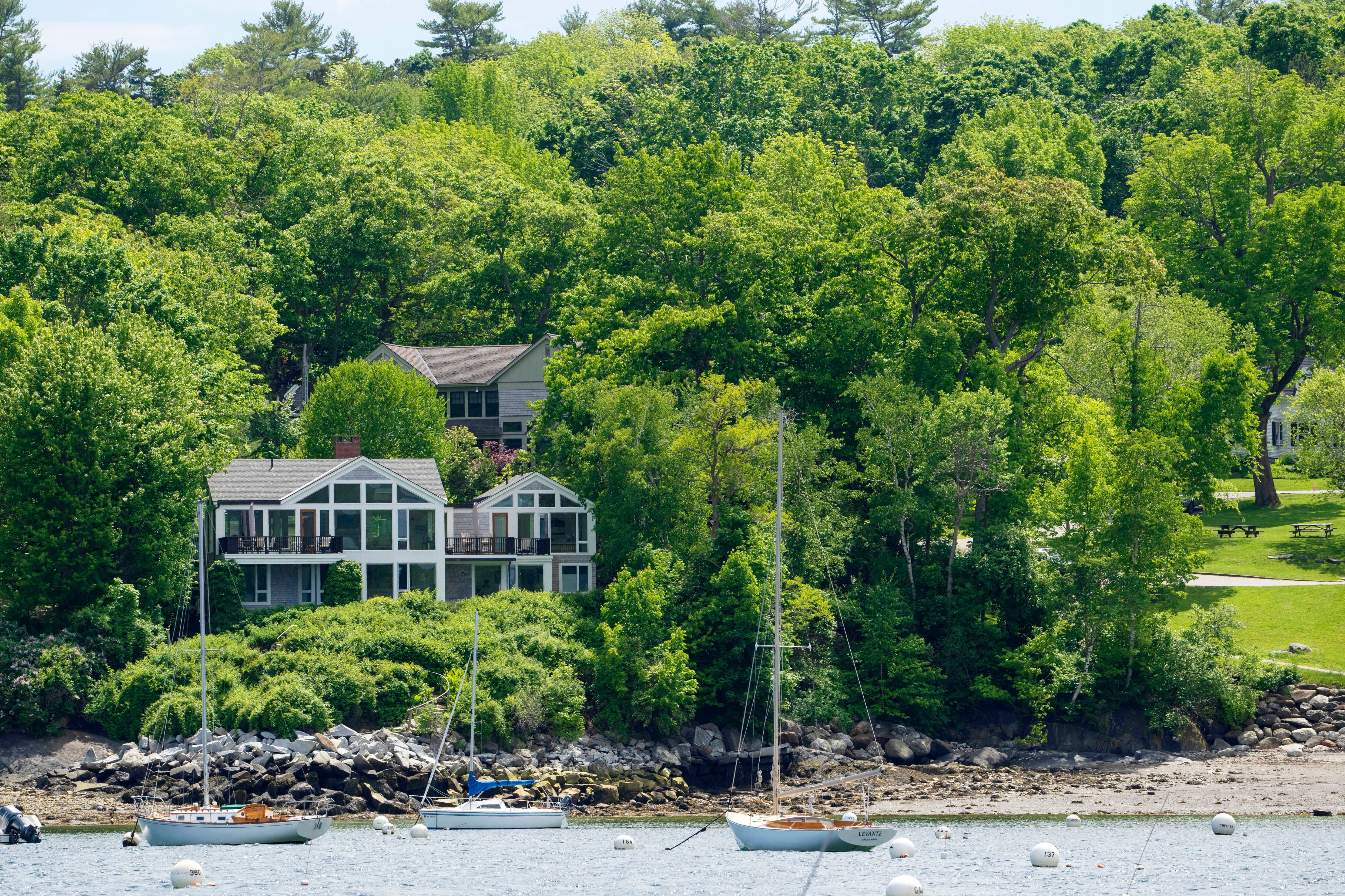 The home of Amelia Bond and her husband, sits behind the waterfront property of Lisa Gorman in Camden, Maine