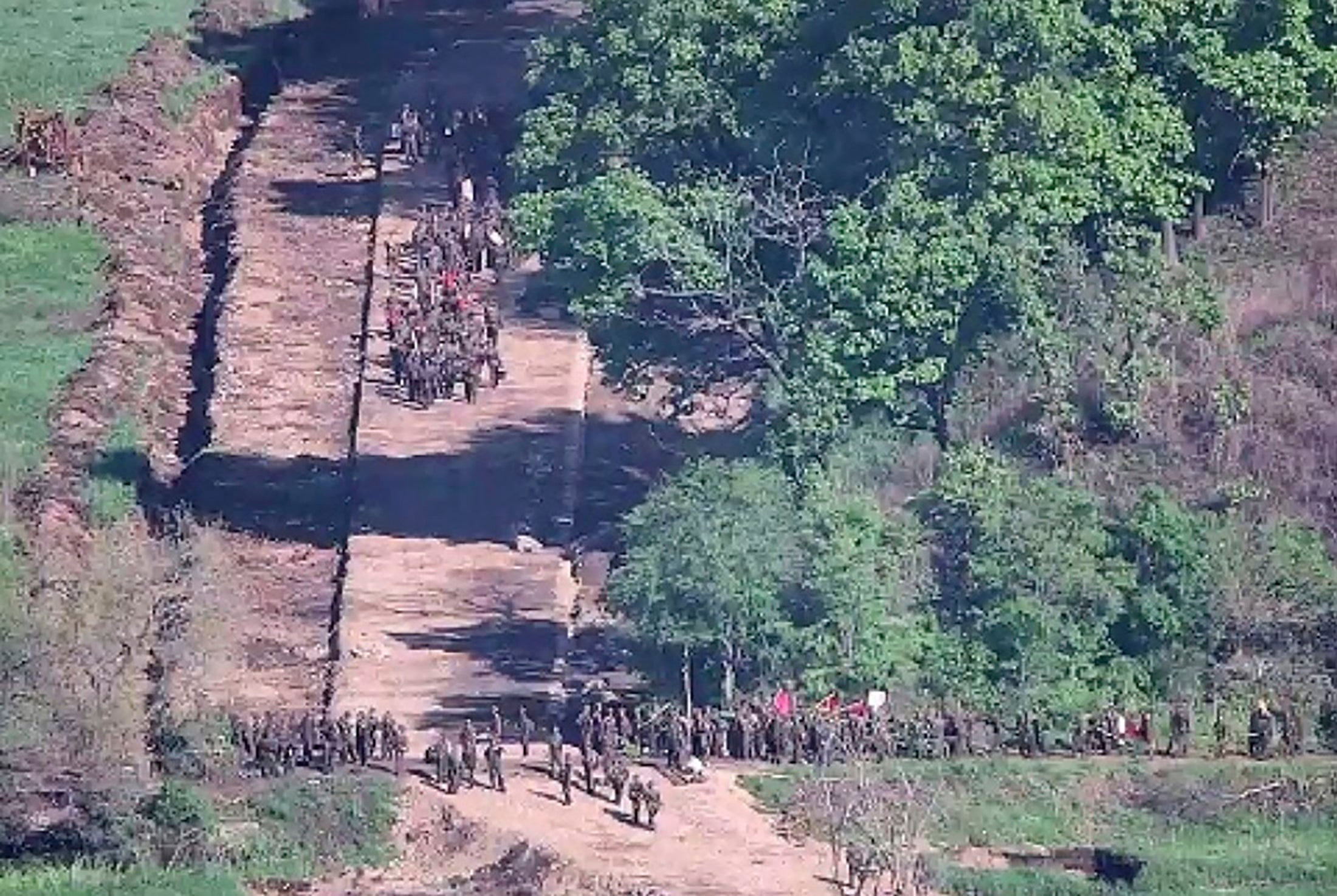 North Korean soldiers work at an undisclosed location near the border area, as seen from a South Korean guard area