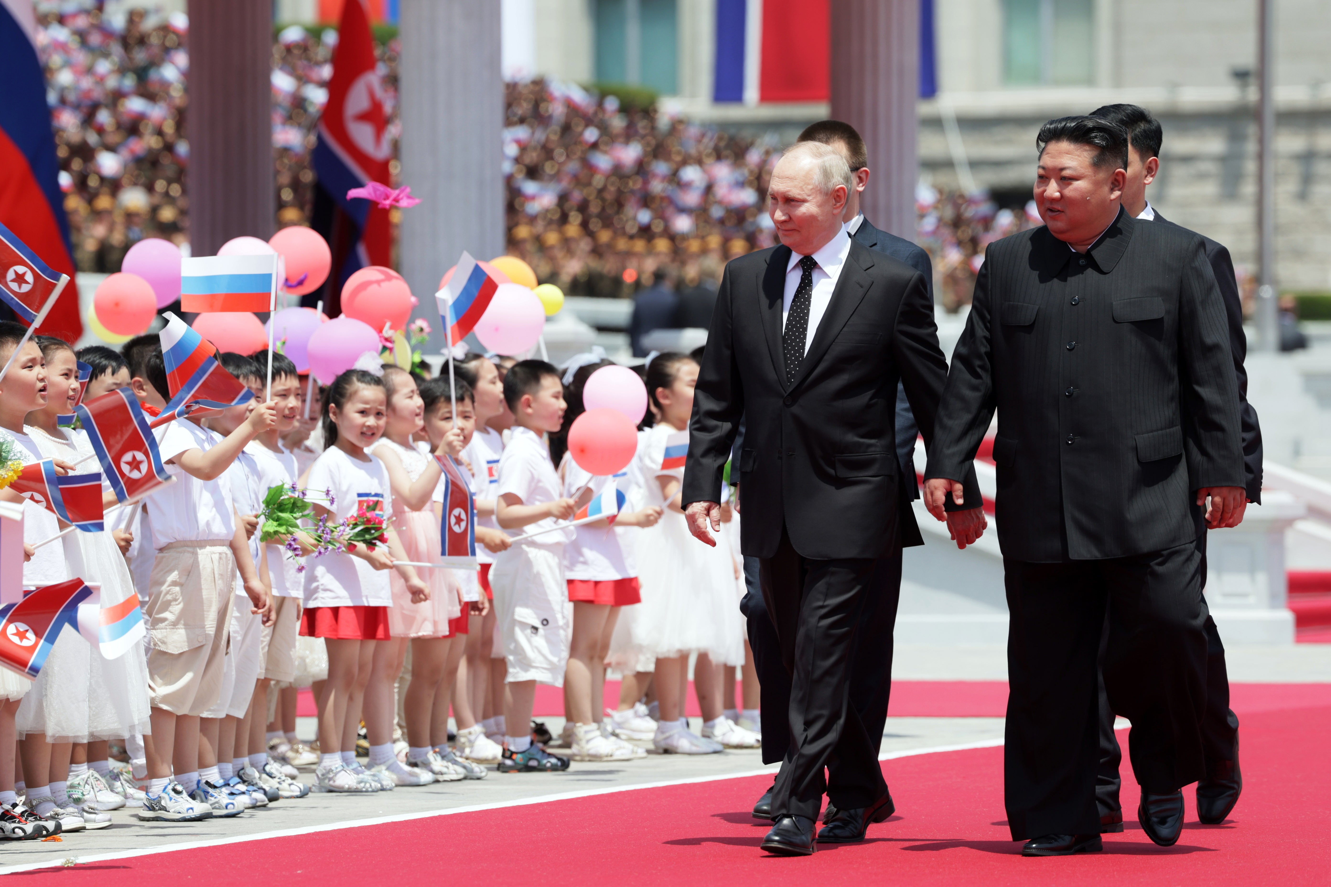 Putin and Kim attend an official welcoming ceremony during their meeting in Pyongyang