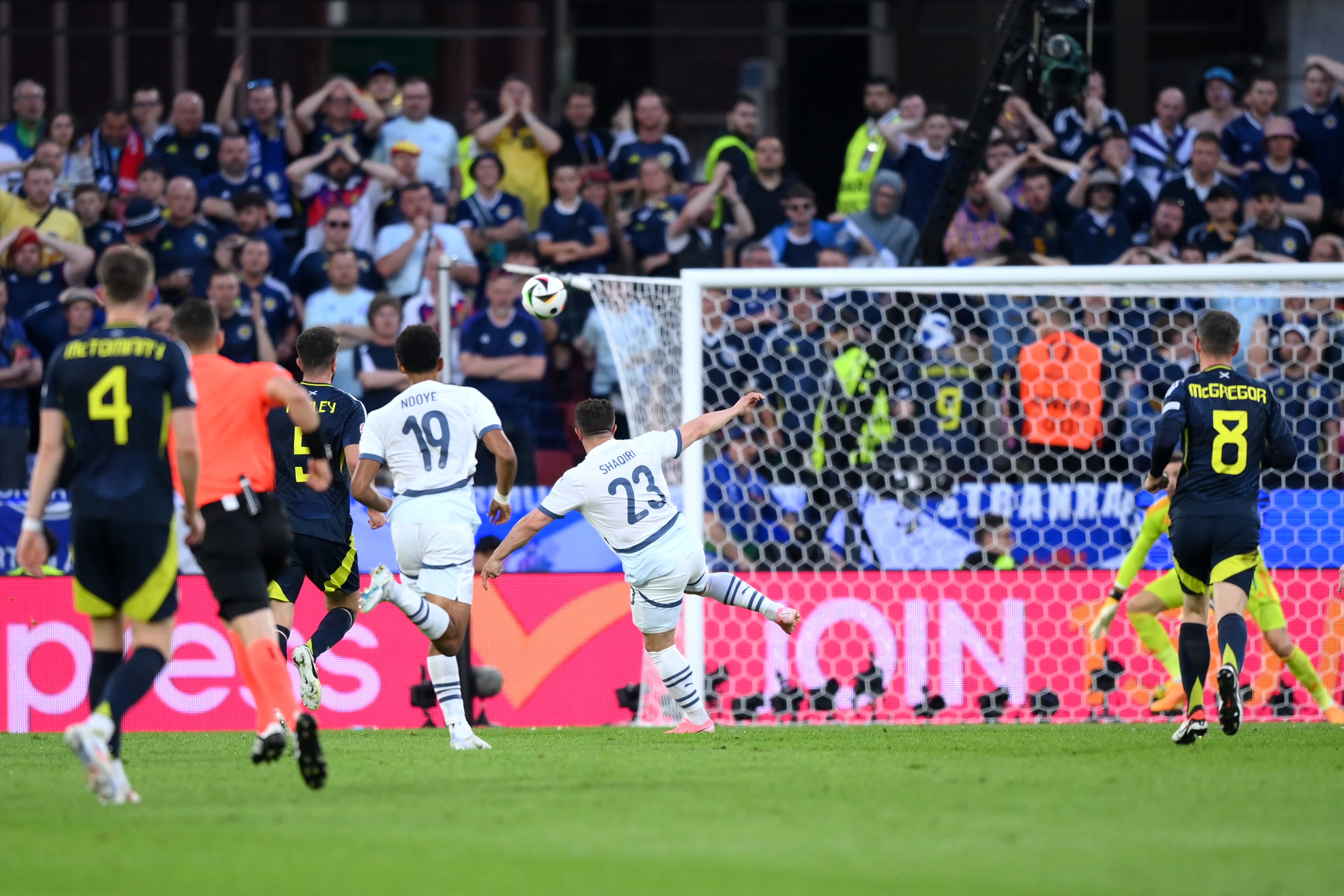 Xherdan Shaqiri sends the ball towards the top corner