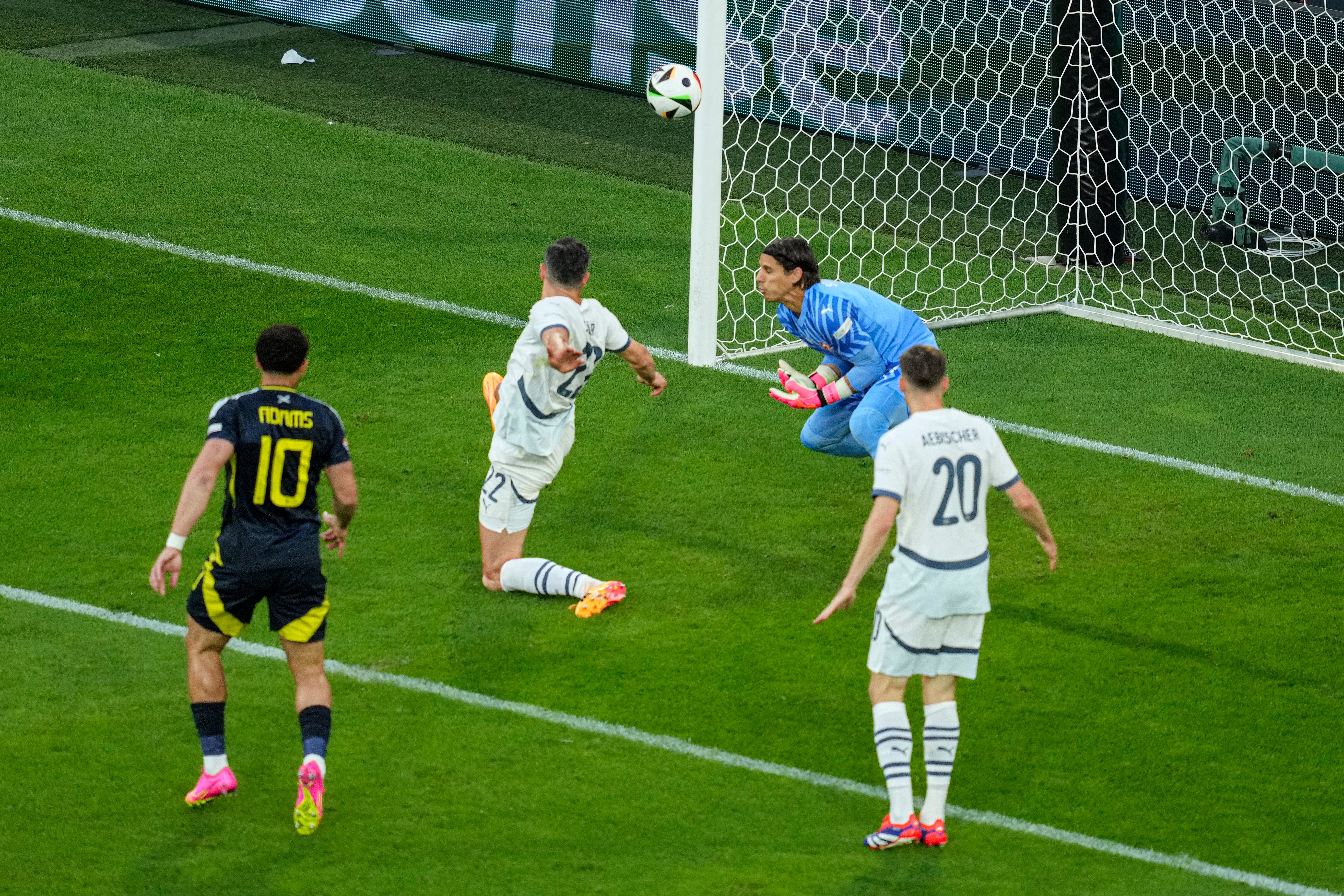 Fabian Schar deflects McTominay’s shot into the goal