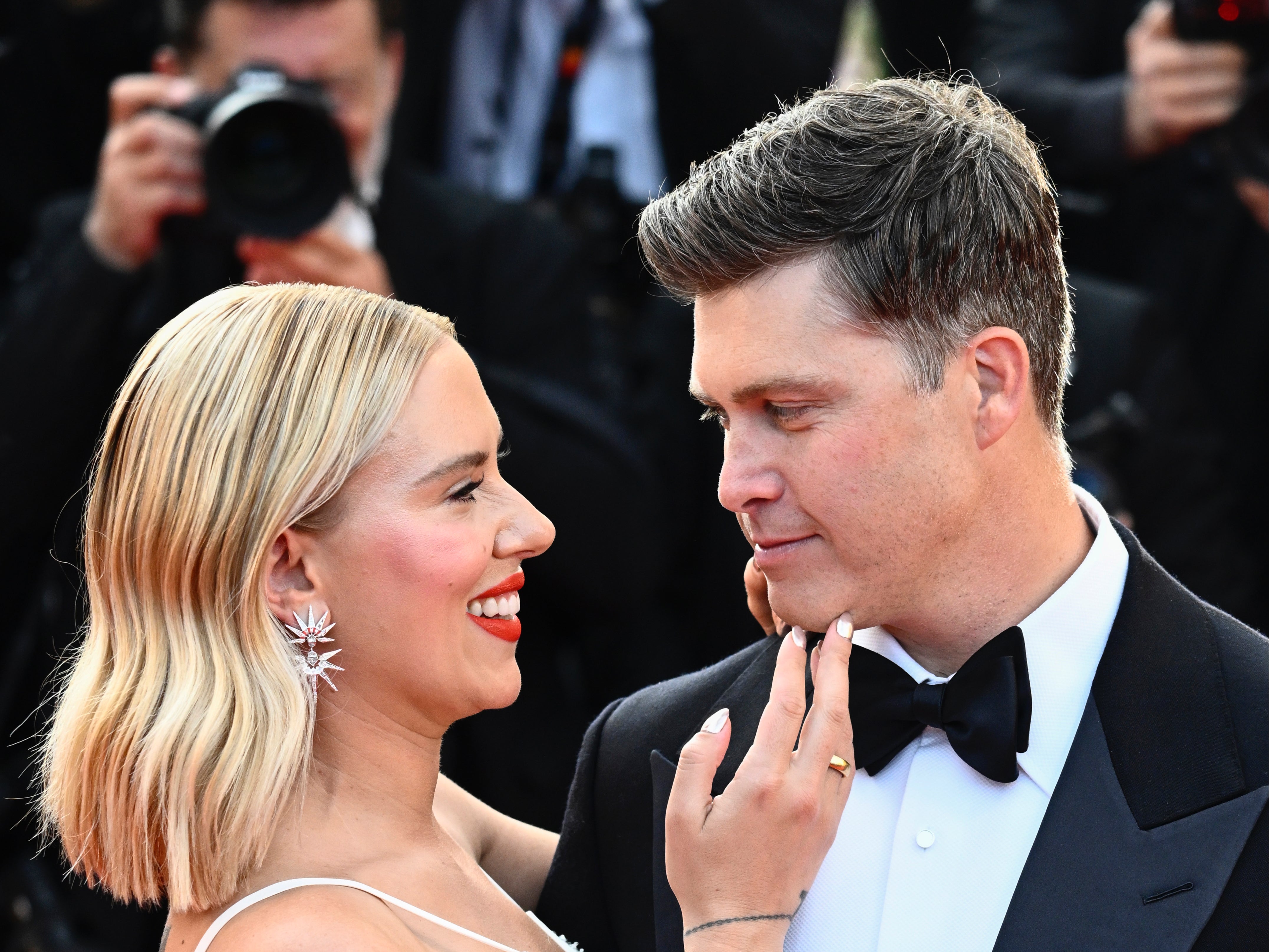 Colin Jost and Scarlett Johansson attend the “Asteroid City” red carpet during the 76th annual Cannes film festival in 2023