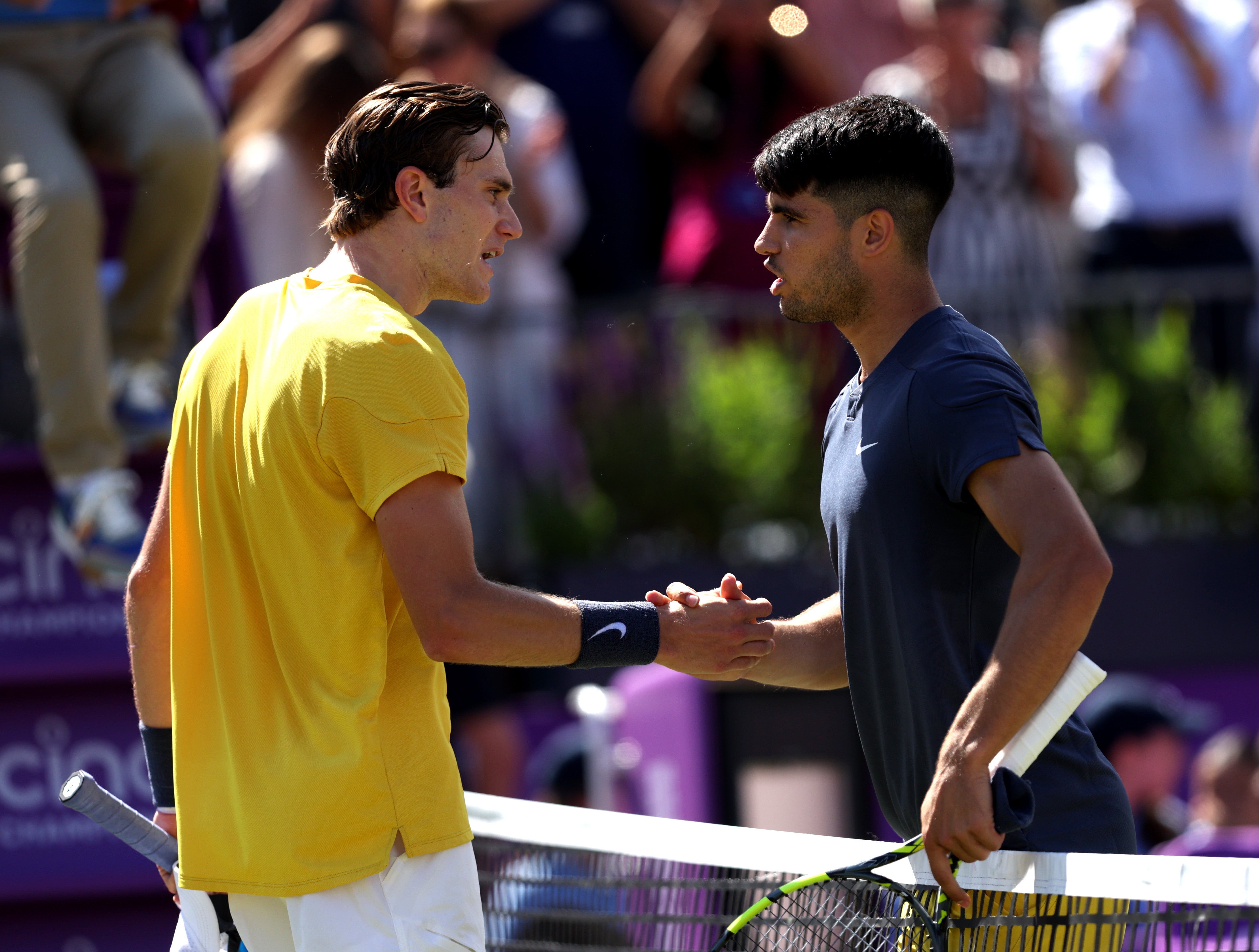 Jack Draper is congratulated by Carlos Alcaraz