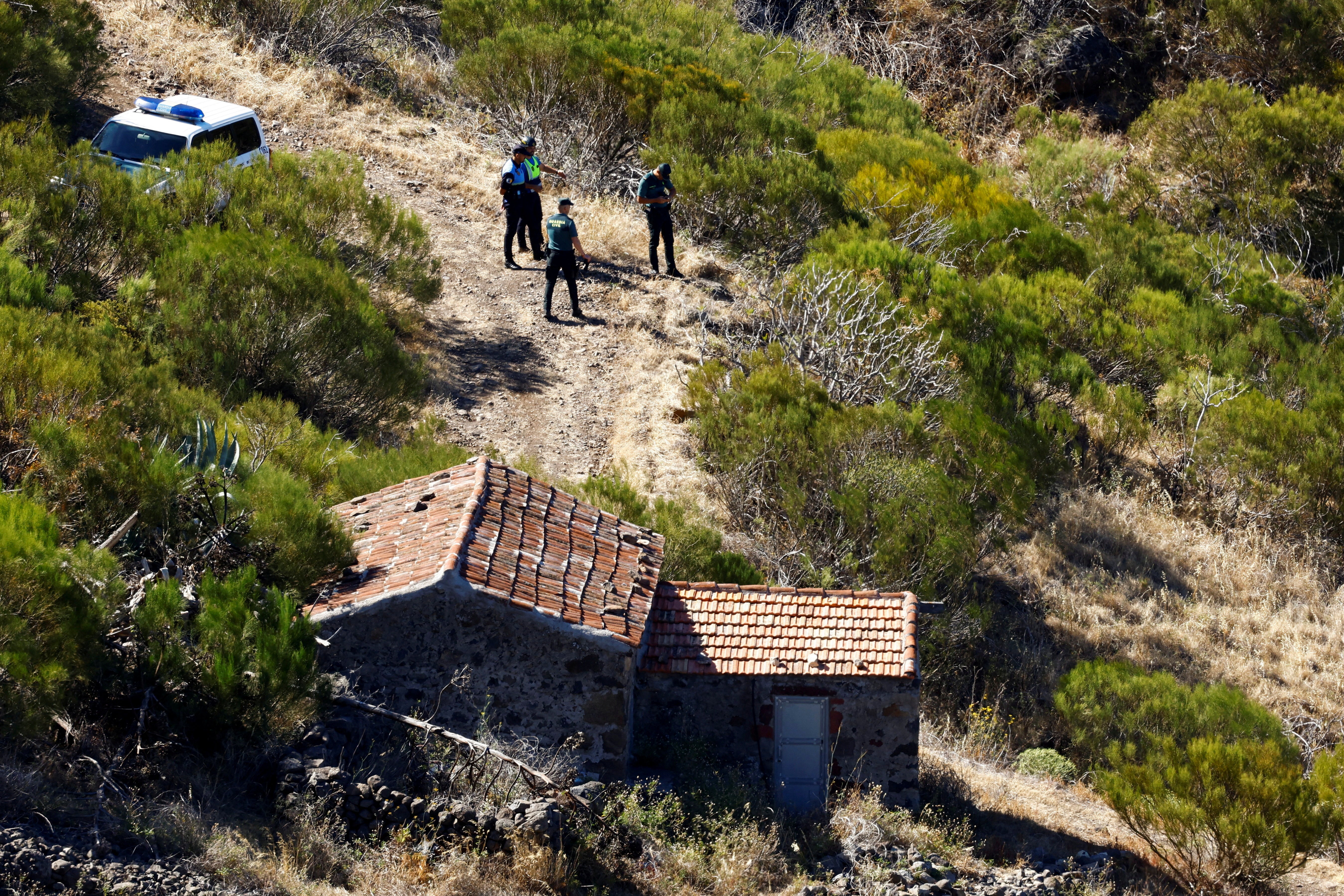 Police officers and voluntary firefighters are searching in the north of the island