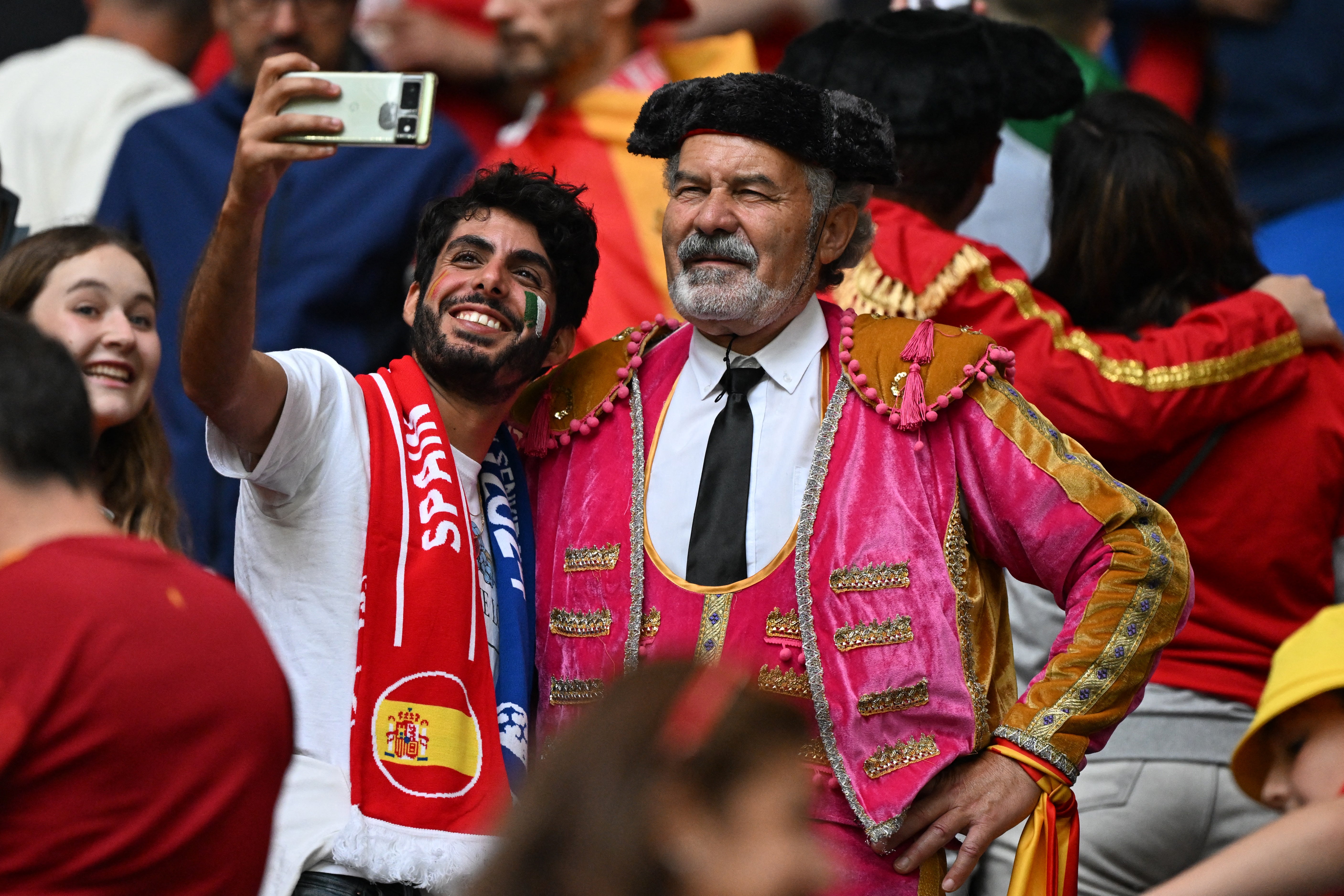 Fans take a selfie in the stands