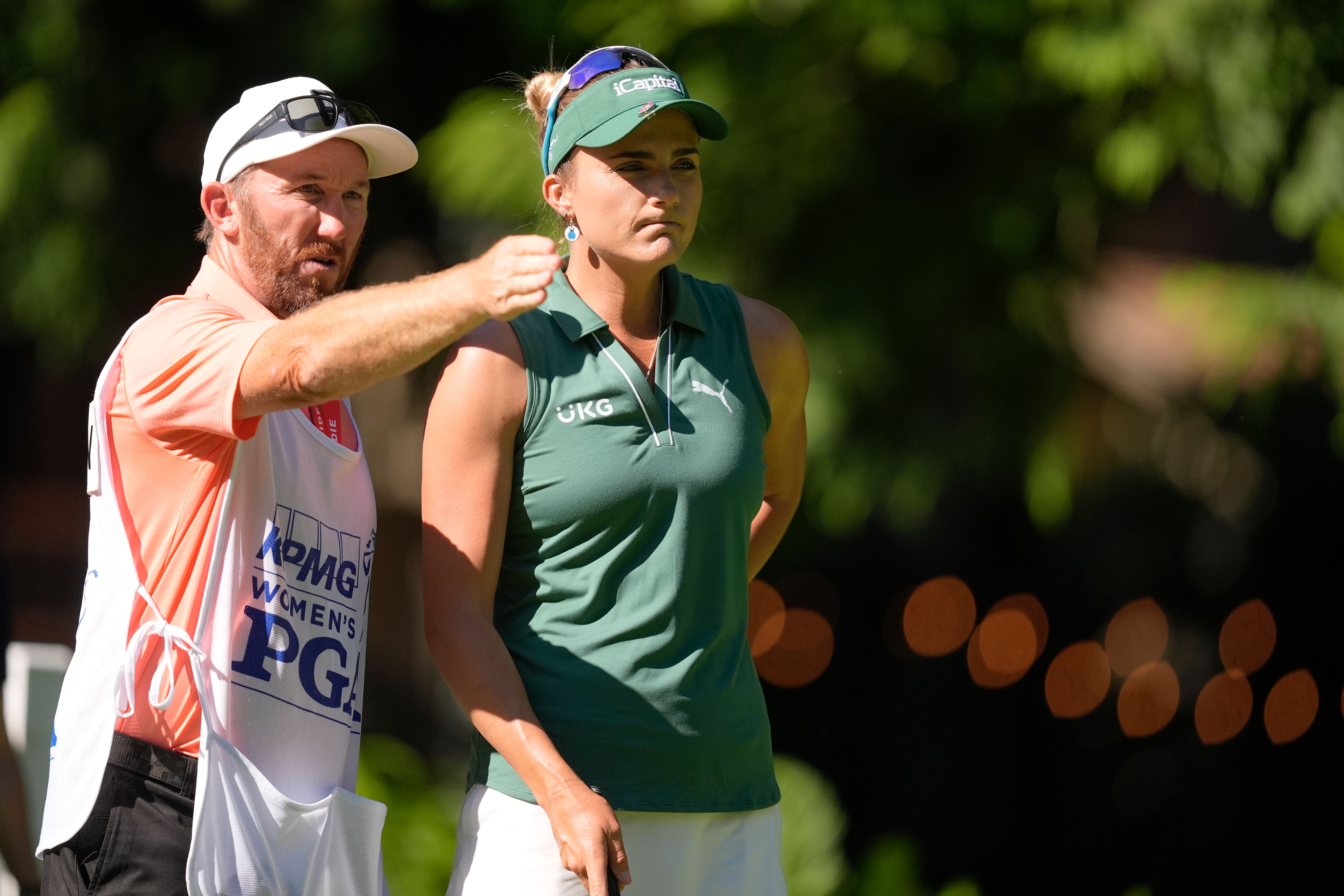 Lexi Thompson talks with her caddie on the 12th tee (Gerald Herbert/AP)