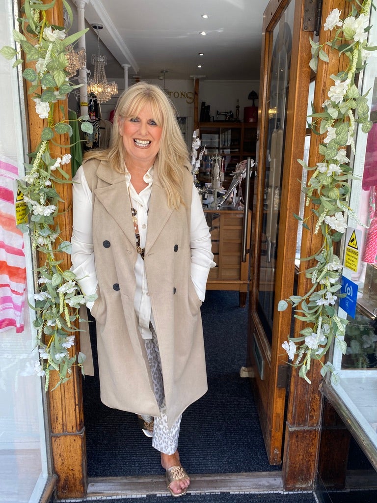 Karen Noble in the doorway of her shop