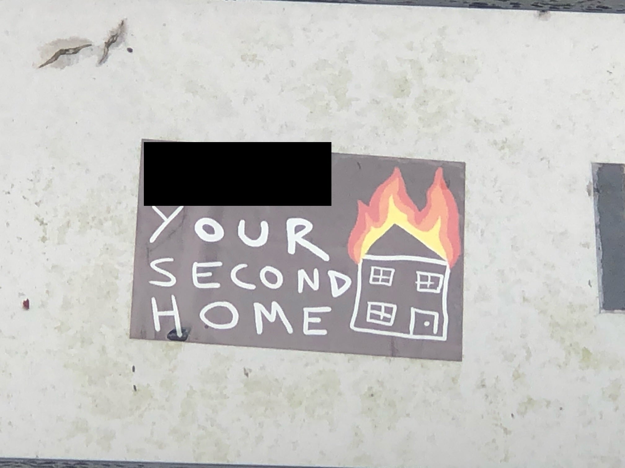 Disturbing stickers appearing to threaten setting second homes on fire have appeared in the Lake District