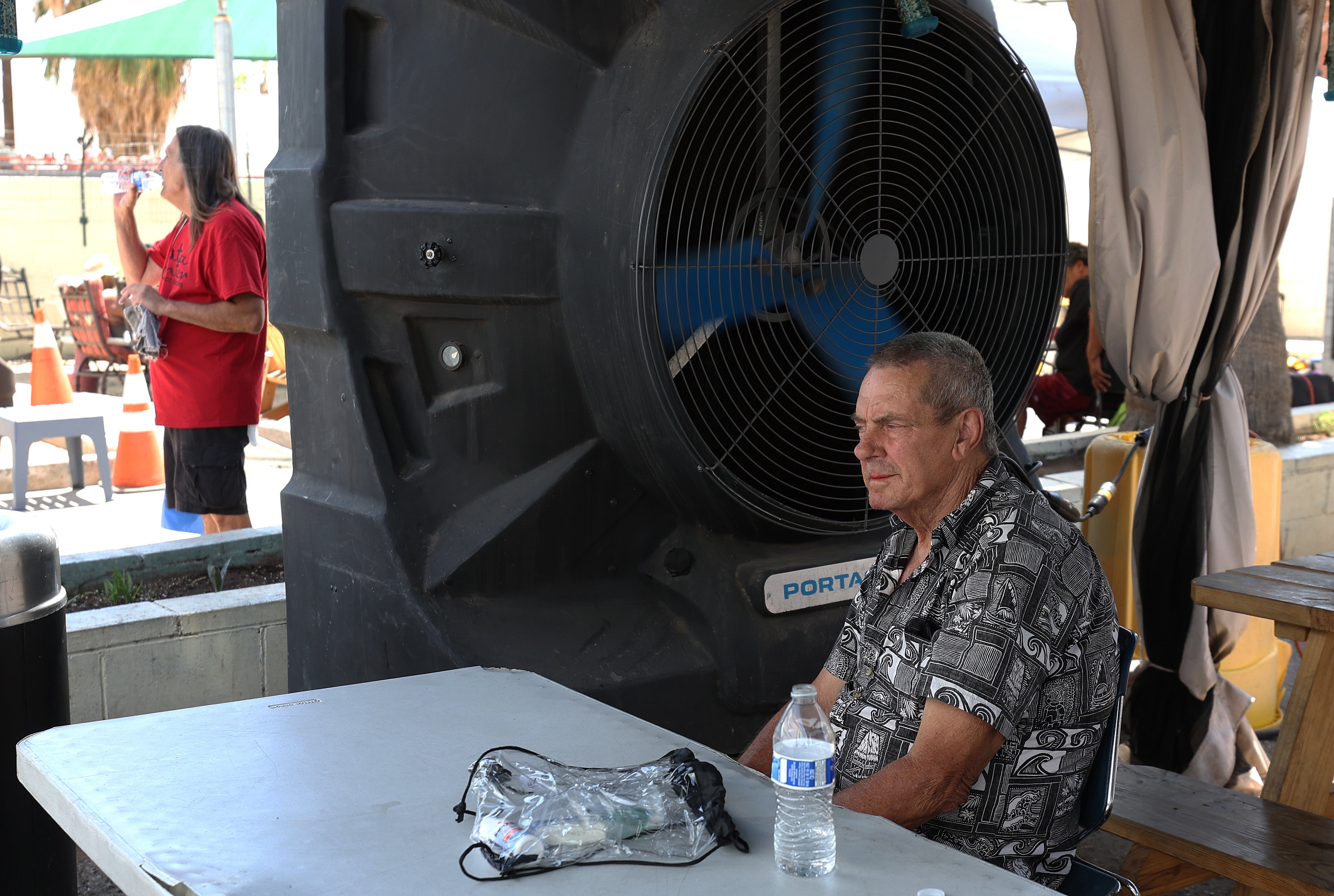 A man sits at a cooling center in Phoenix, Arizona as the state saw its first heat wave of the year in June. Heat-related illness can prove deadly, experts say, especially for vulnerable populations