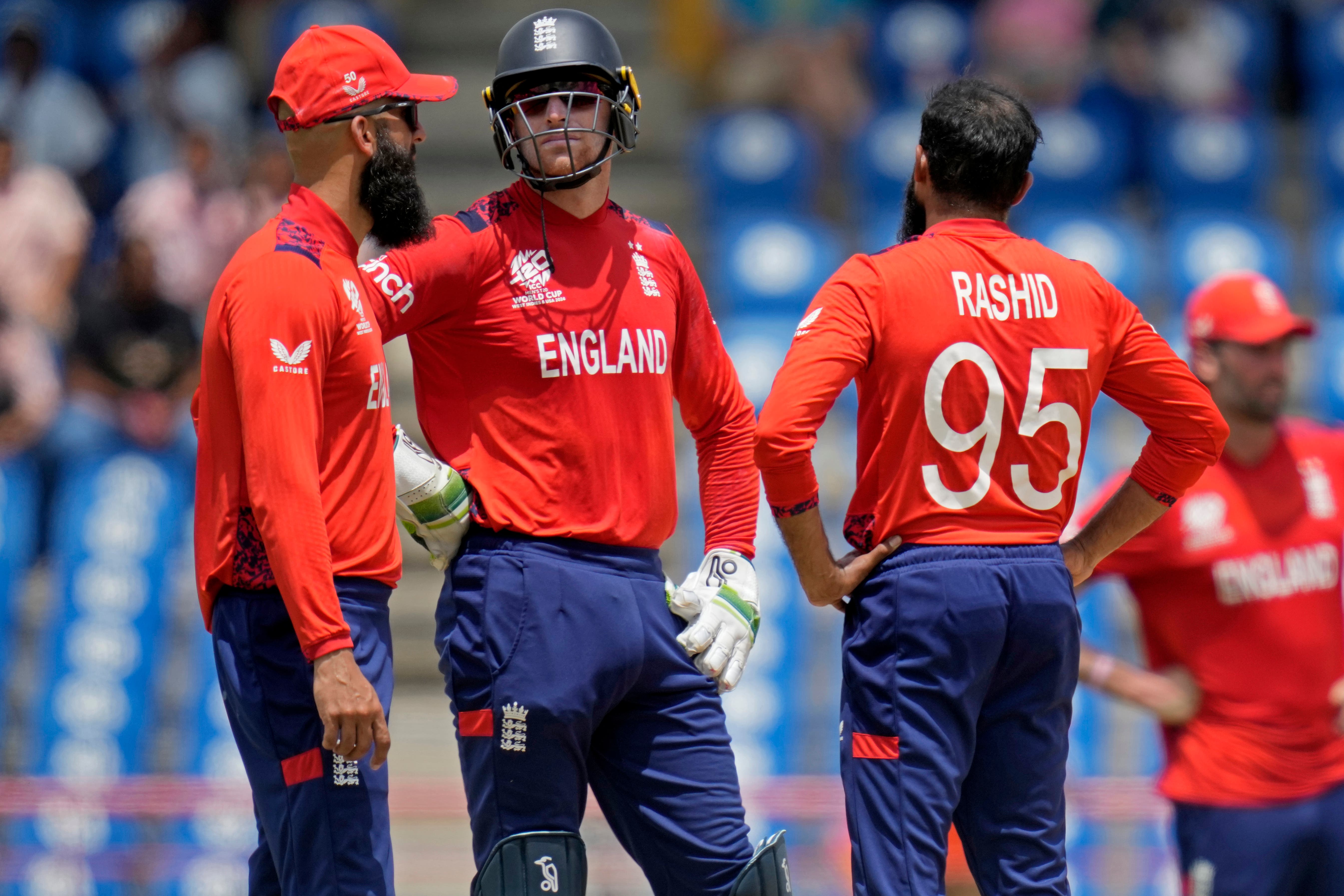 Jos Buttler, second left, admitted England fell short with the bat (AP Photo/Ramon Espinosa)