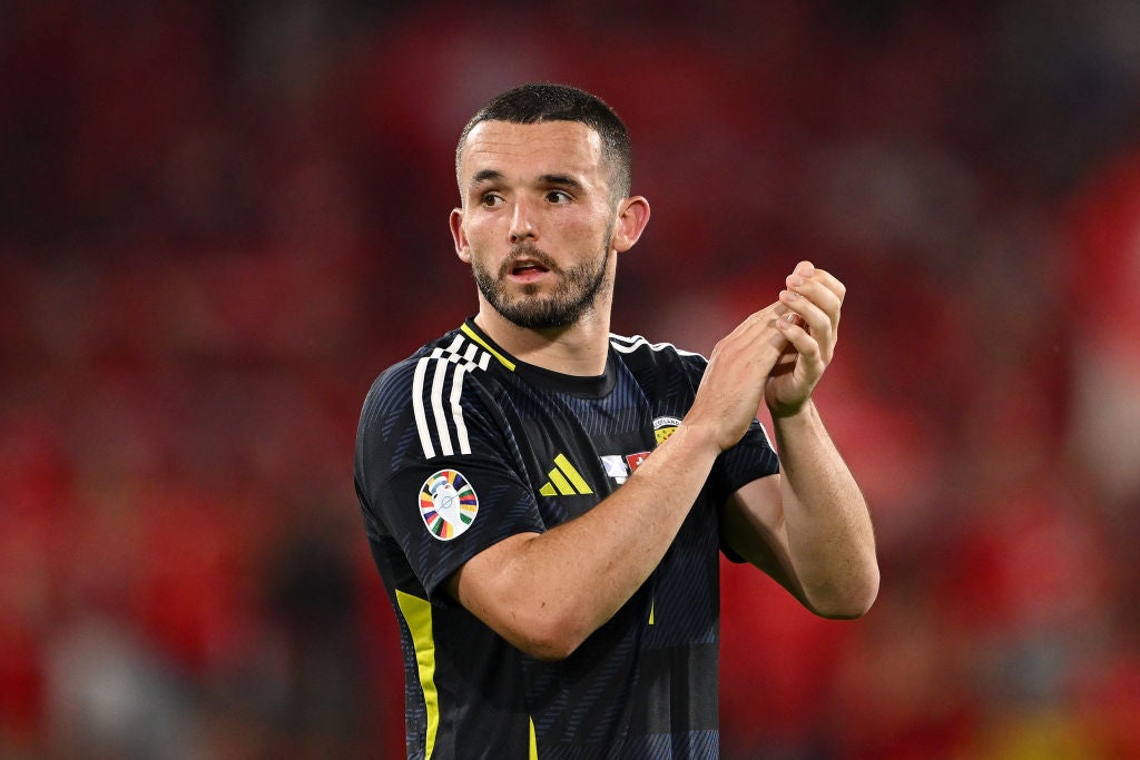 McGinn applauds the Tartan Army after he is brought off in the 1-1 draw against Switzerland