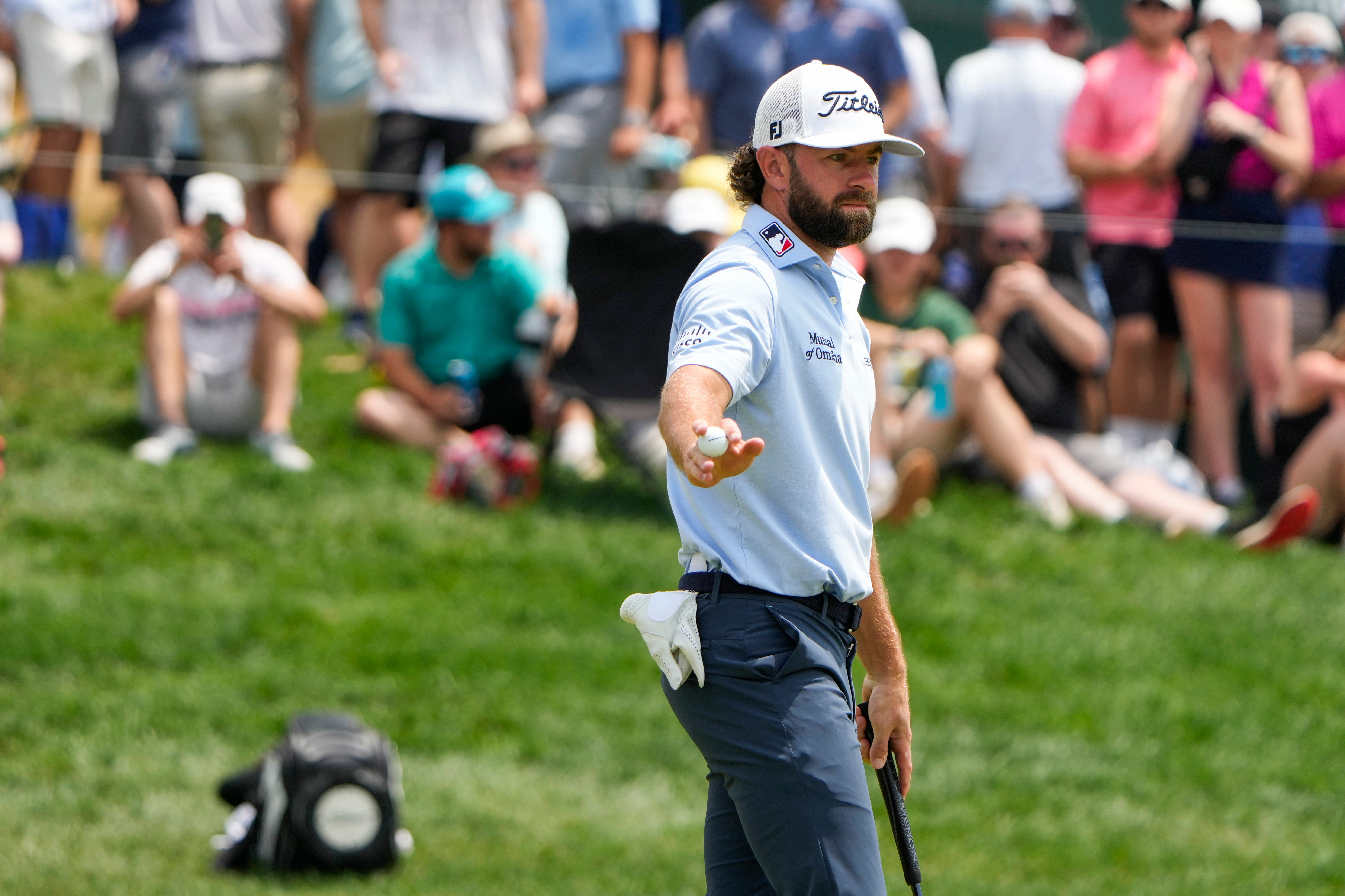 Cameron Young reacts after making a putt on the 17th green during the third round of the Travelers Championship golf tournament at TPC River Highlands, Saturday, June 22, 2024, in Cromwell, Conn. (AP Photo/Seth Wenig)