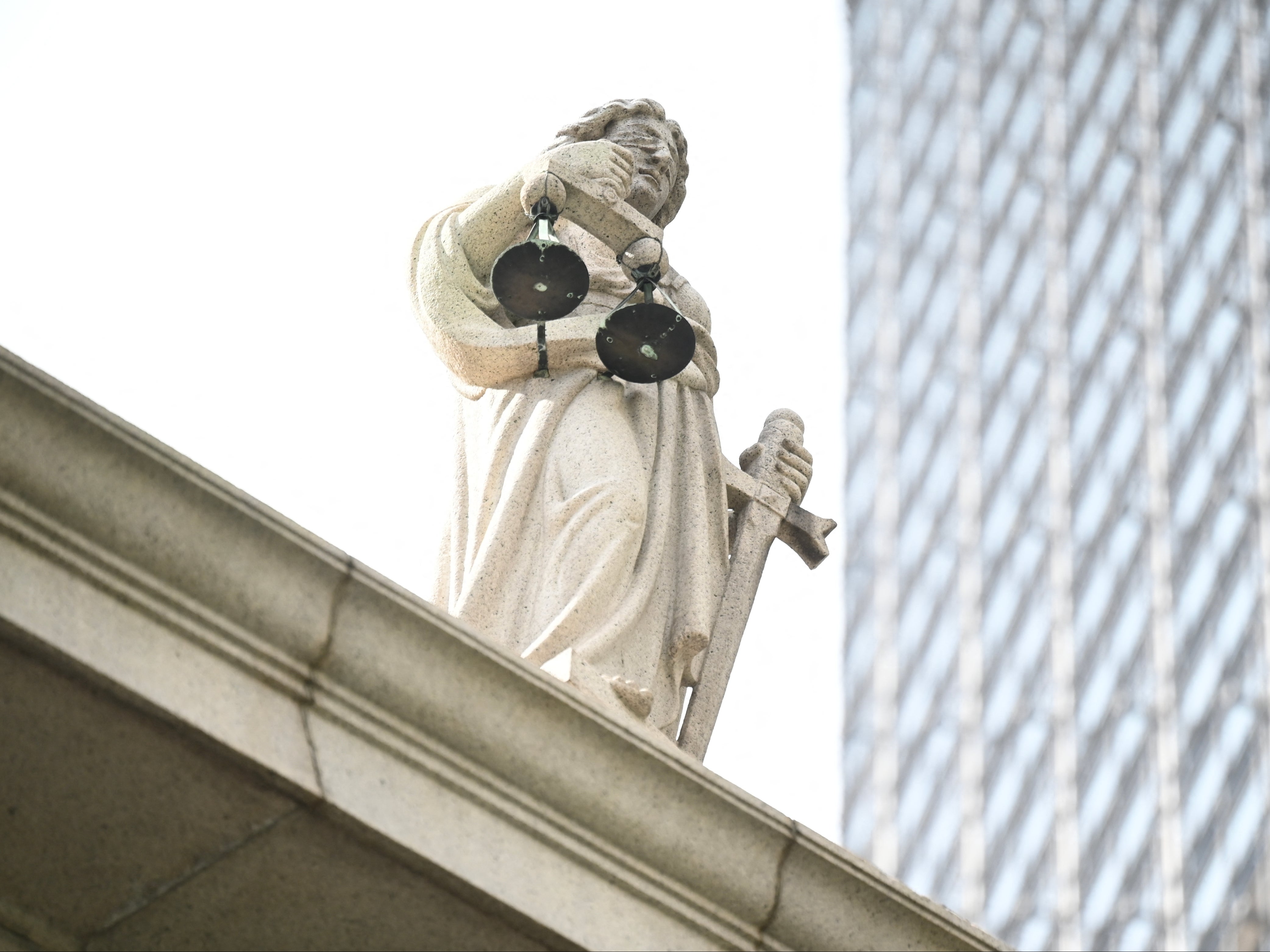 The scales of justice are seen on top of the Court of Final Appeal in Hong Kong on 24 June 2024