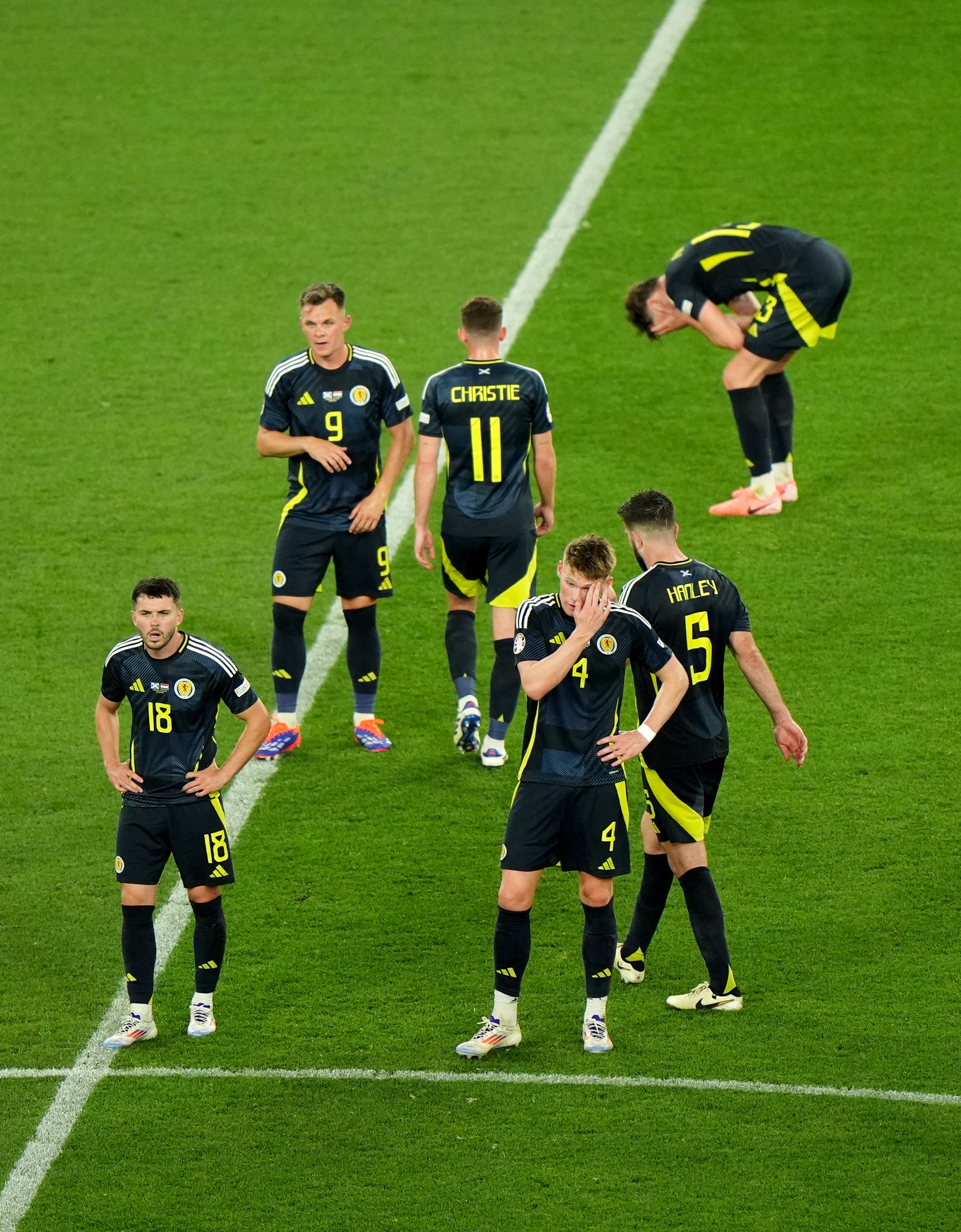 Scotland players react to being beaten by Hungary