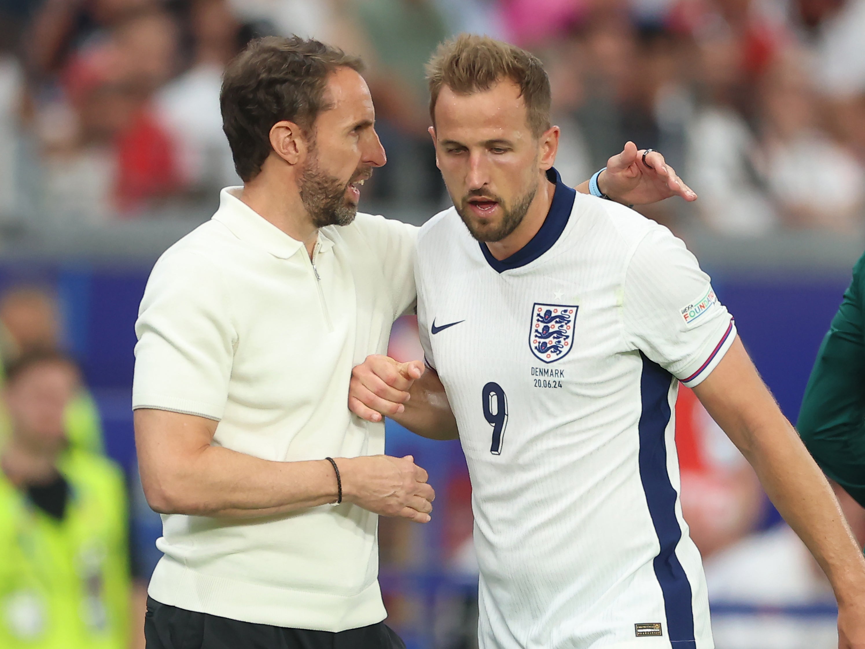 Gareth Southgate with Harry Kane, who he substituted against Denmark