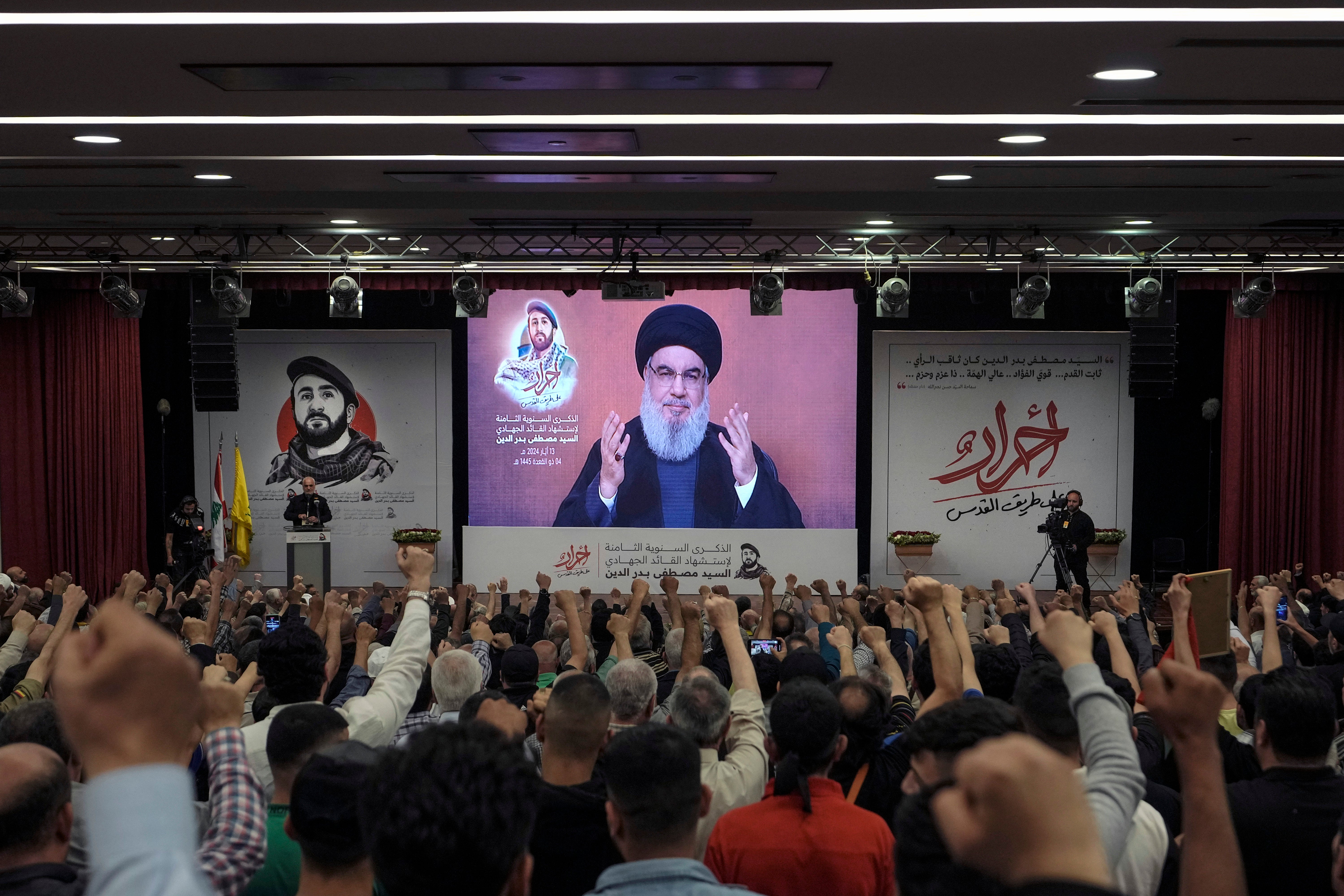 Supporters of the Iranian-backed Hezbollah group listen to a speech by leader Sayyed Hassan Nasrallah