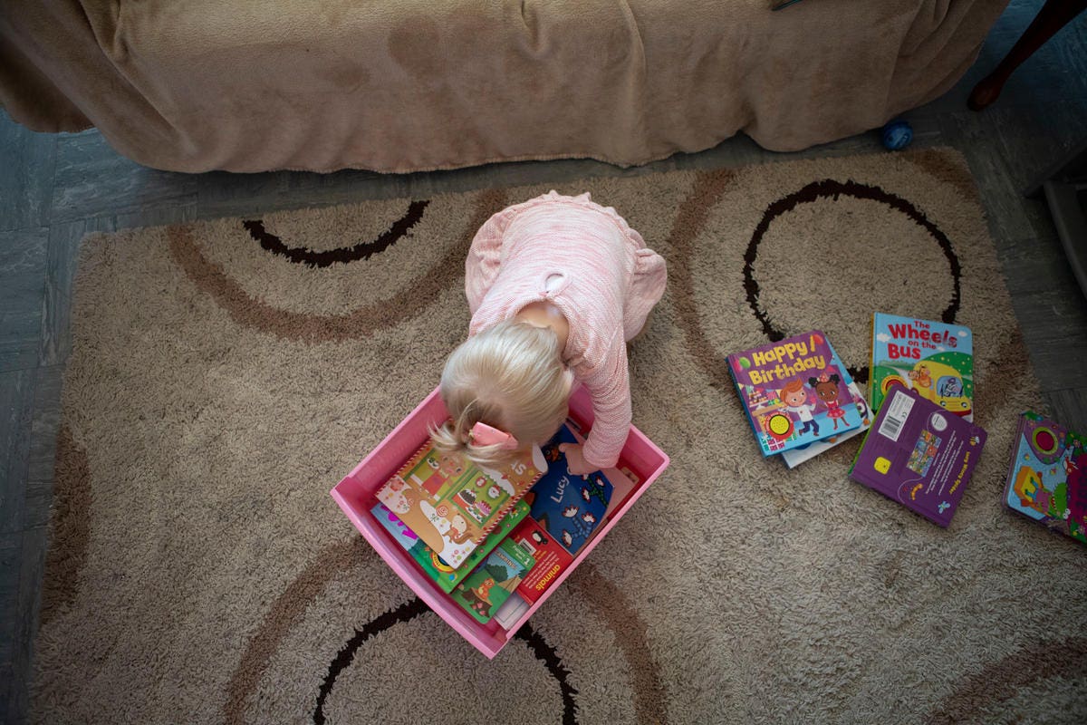 Handout photo issued by Save the Children of a child with books(Save the Children/PA)