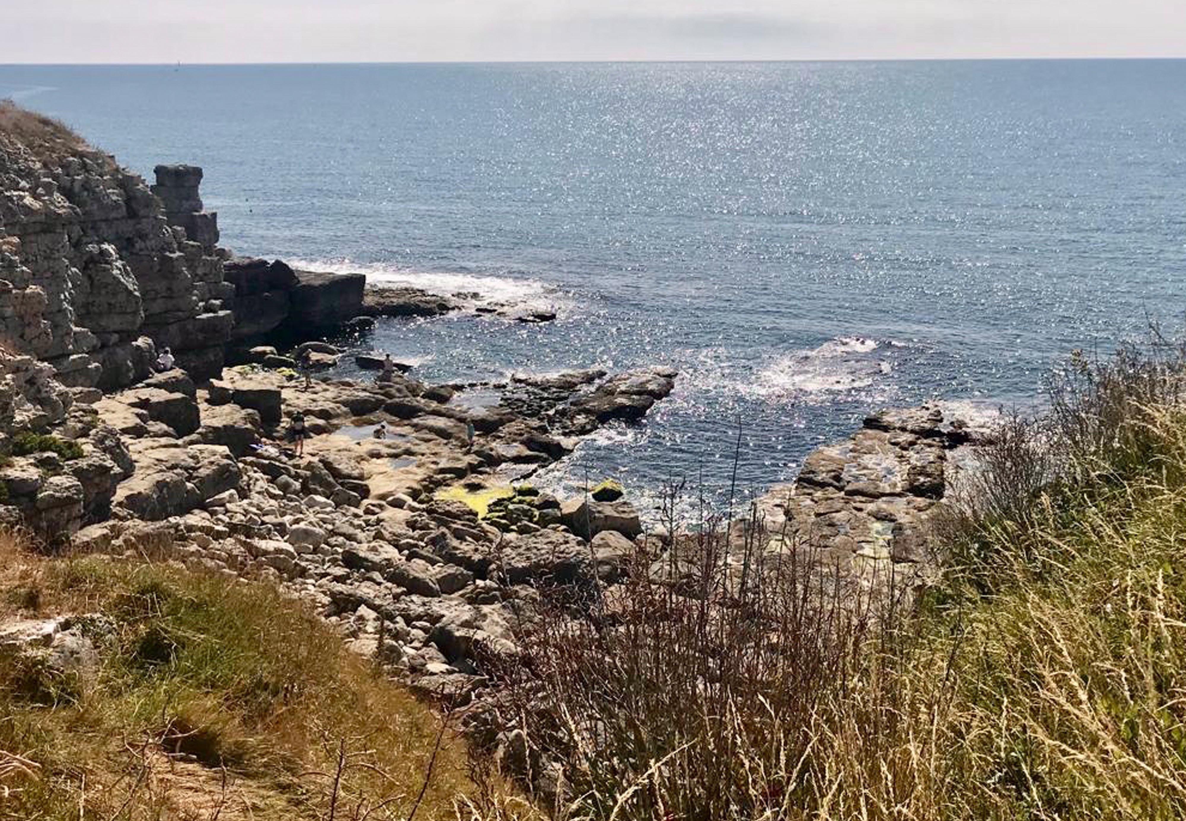 The elderly woman slipped over a sheer drop at Winspit Quarry, Dorset, on Saturday