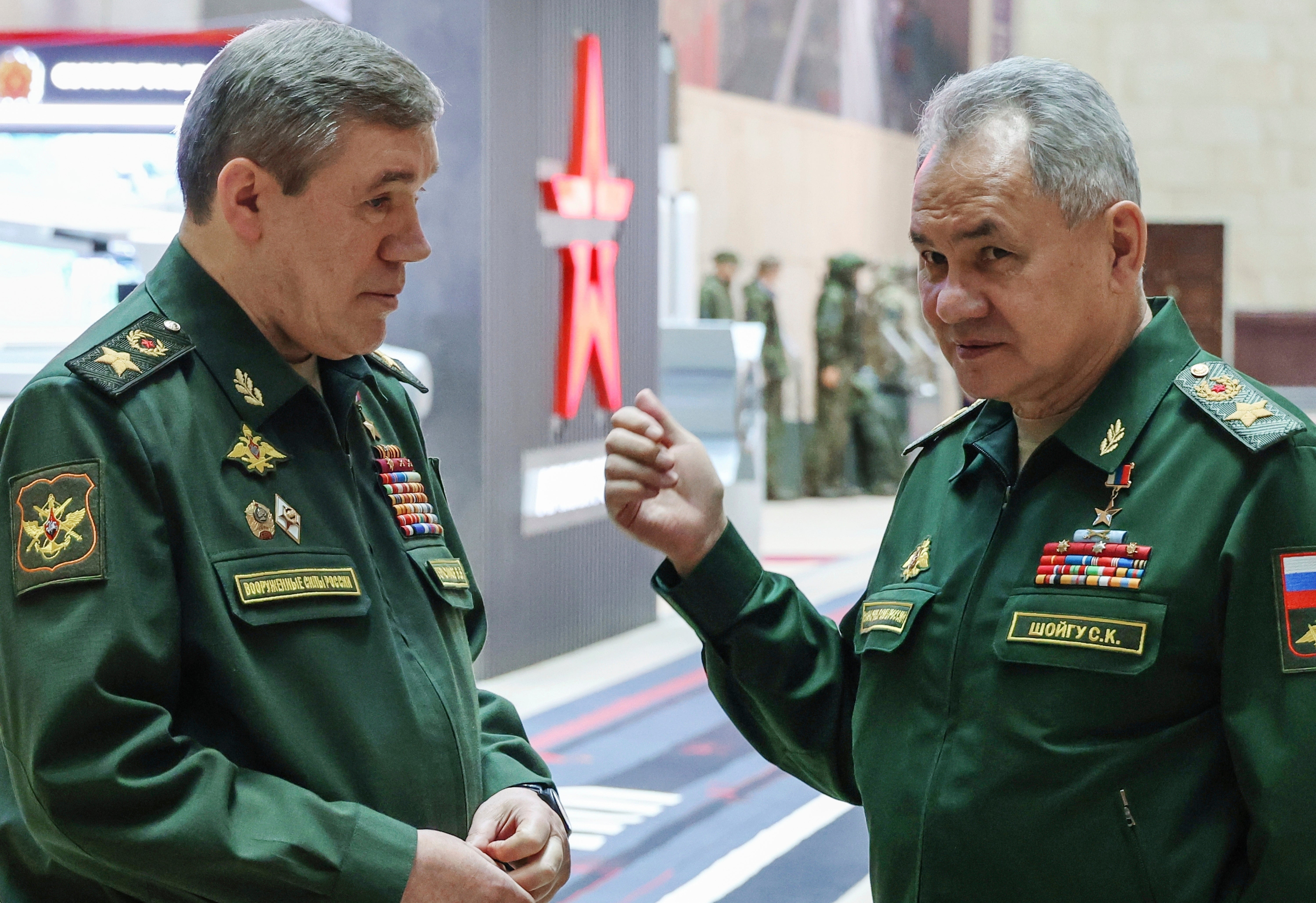 Former Russian defence minister Sergei Shoigu, right, gestures as he speaks to chief of the general staff Valery Gerasimov in Moscow in December 2023