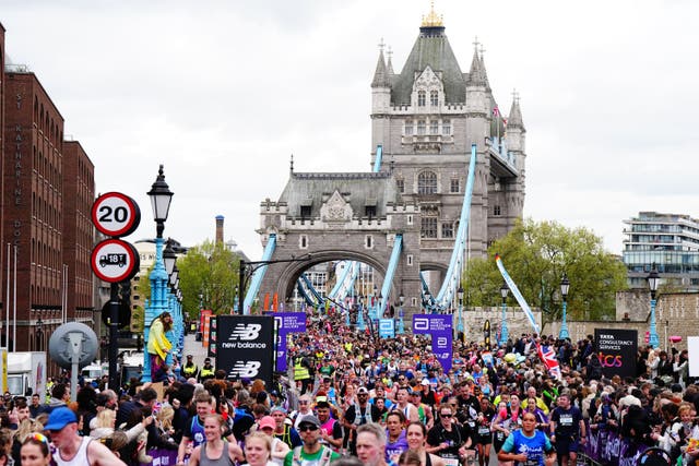 <p>Runners cross Tower Bridge during the TCS London Marathon 2024
</p>