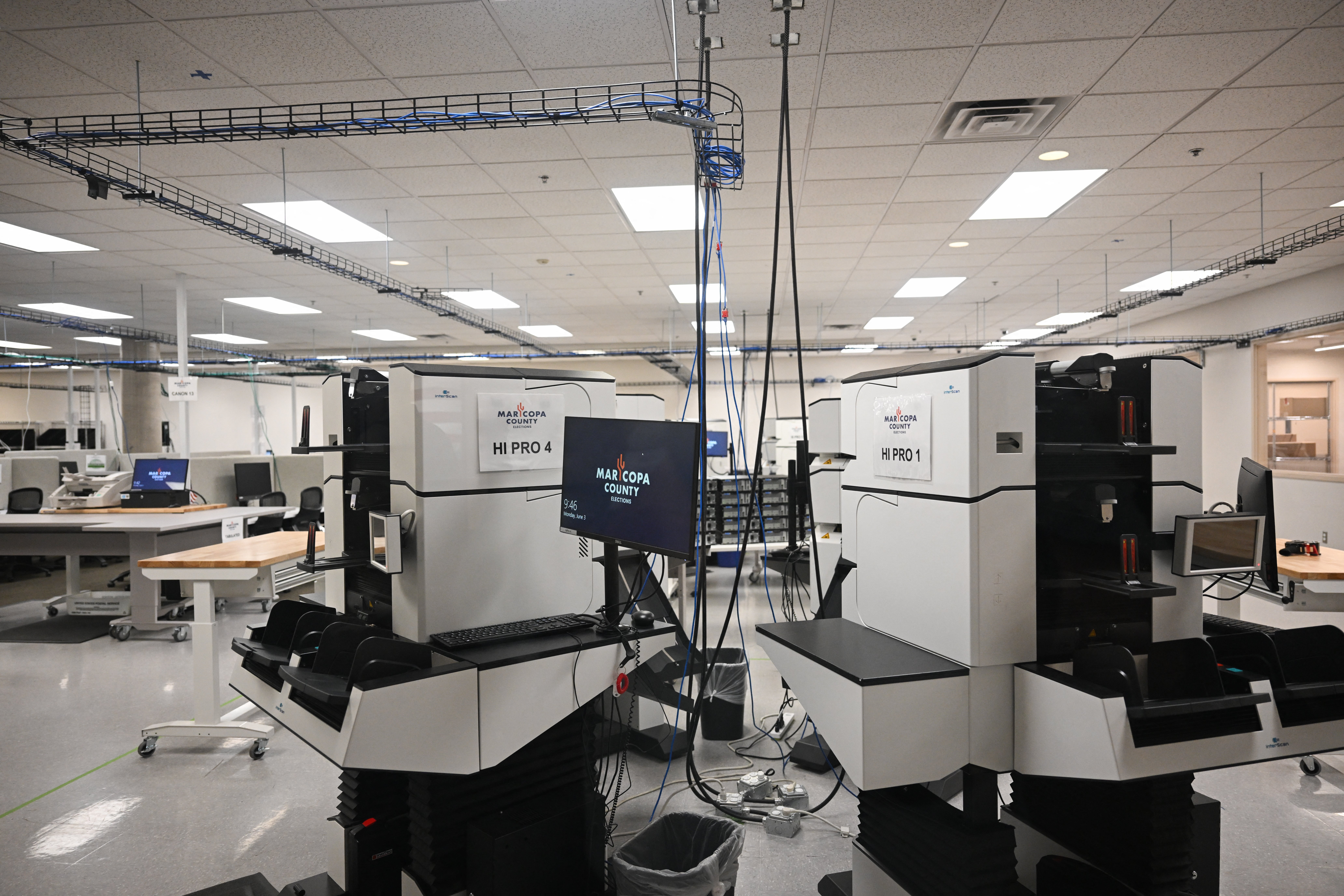 High speed tabulation machines for counting early ballots stand secured in the tabulation room at the Maricopa County Tabulation and Election Center ahead of the 2024 Arizona Primary and General elections in Phoenix on June 3