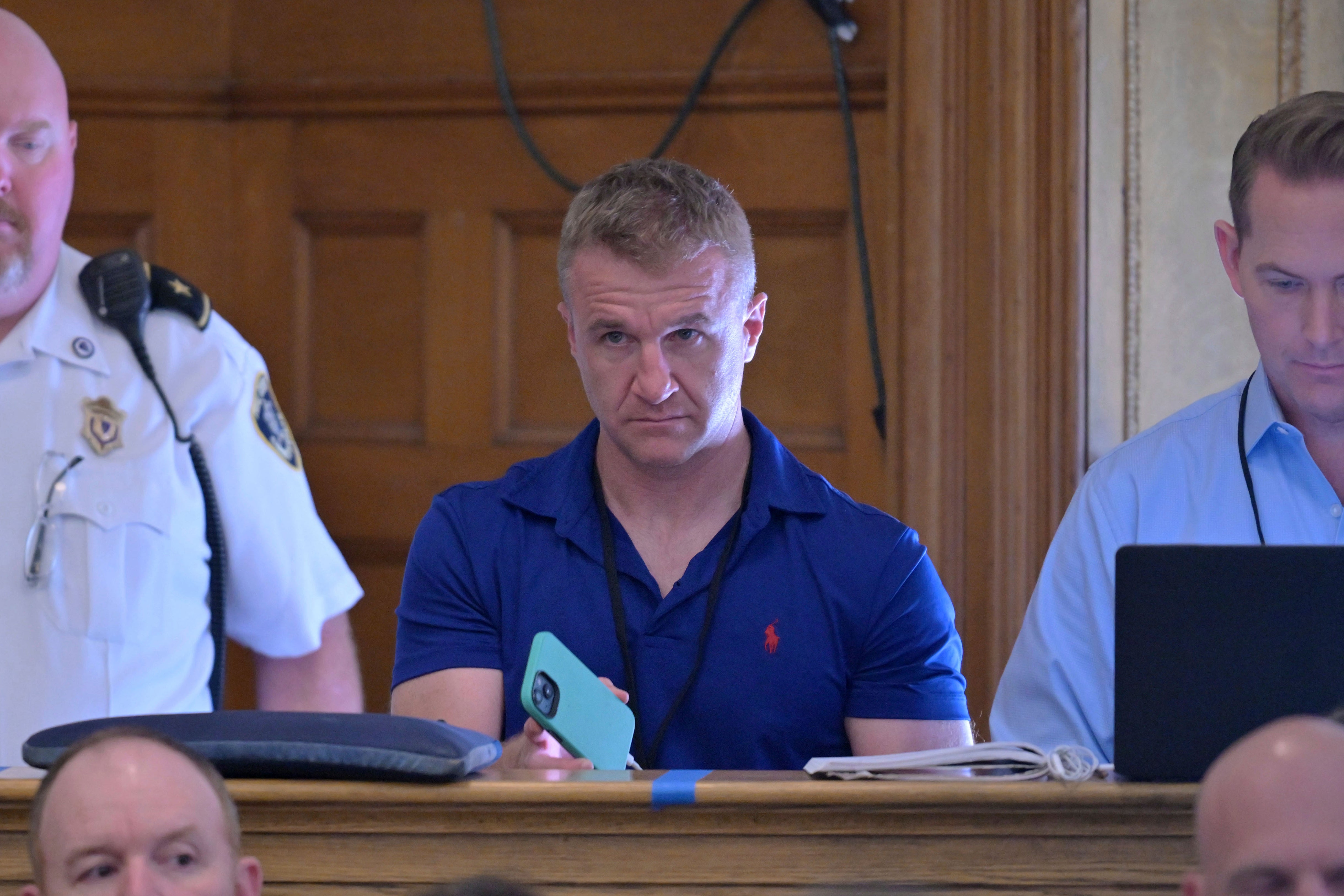 Blogger Aidan Kearney, second from right, listens from the press bench during Karen Read's murder trial in June