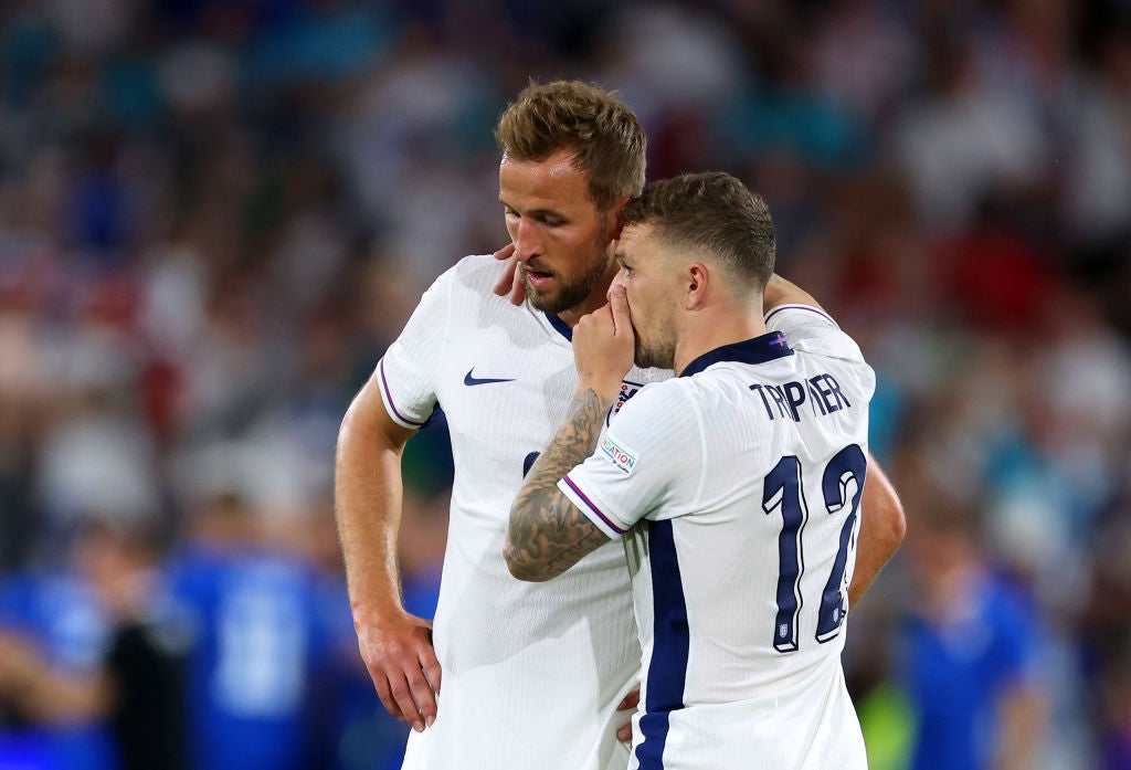 Harry Kane speaks with teammate Kieran Trippier after the UEFA EURO 2024 group stage match between England and Slovenia at Cologne Stadium