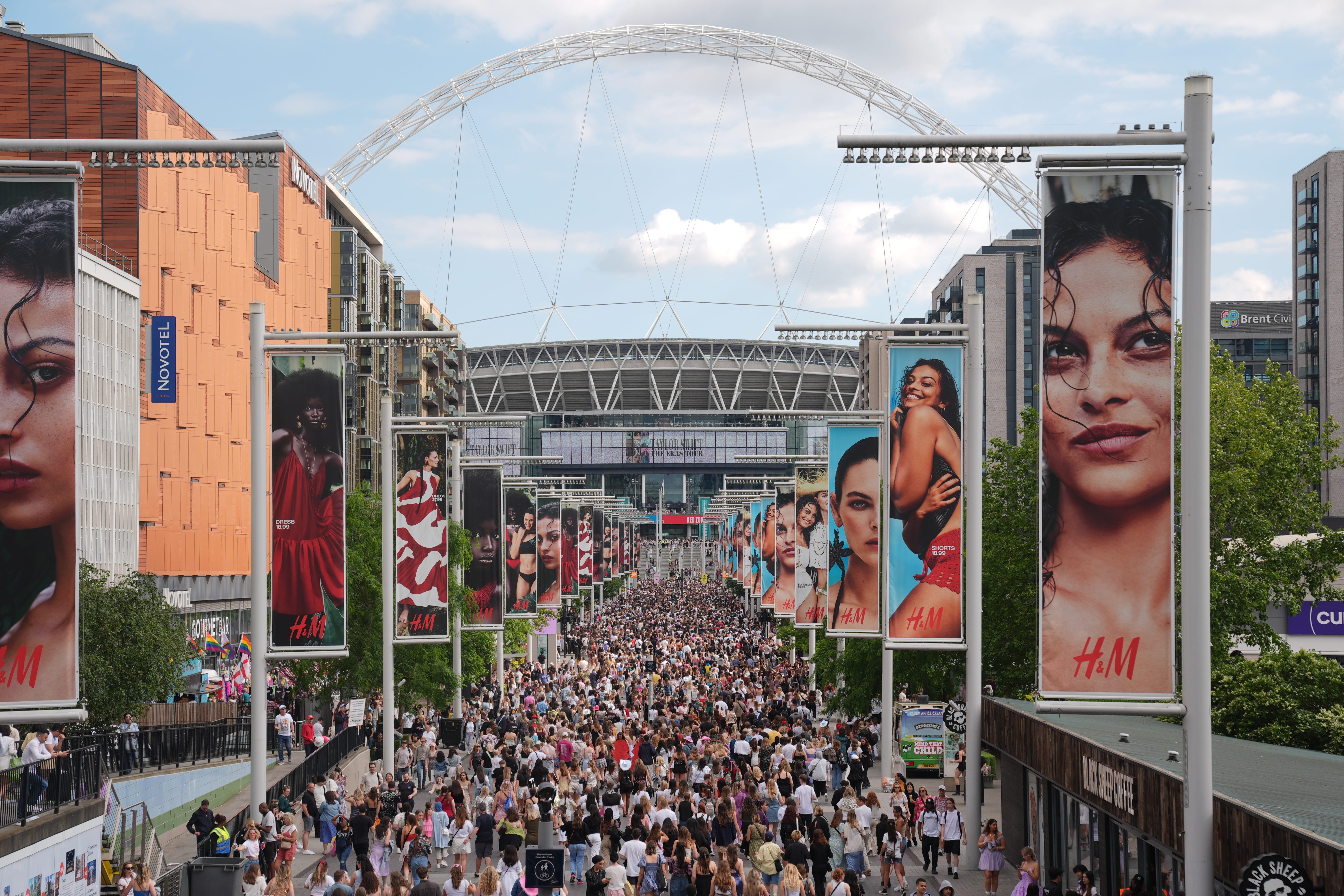 Fans gather outside Wembley Stadium ahead of Taylor Swift’s first London concert in June, during her Eras Tour (PA)