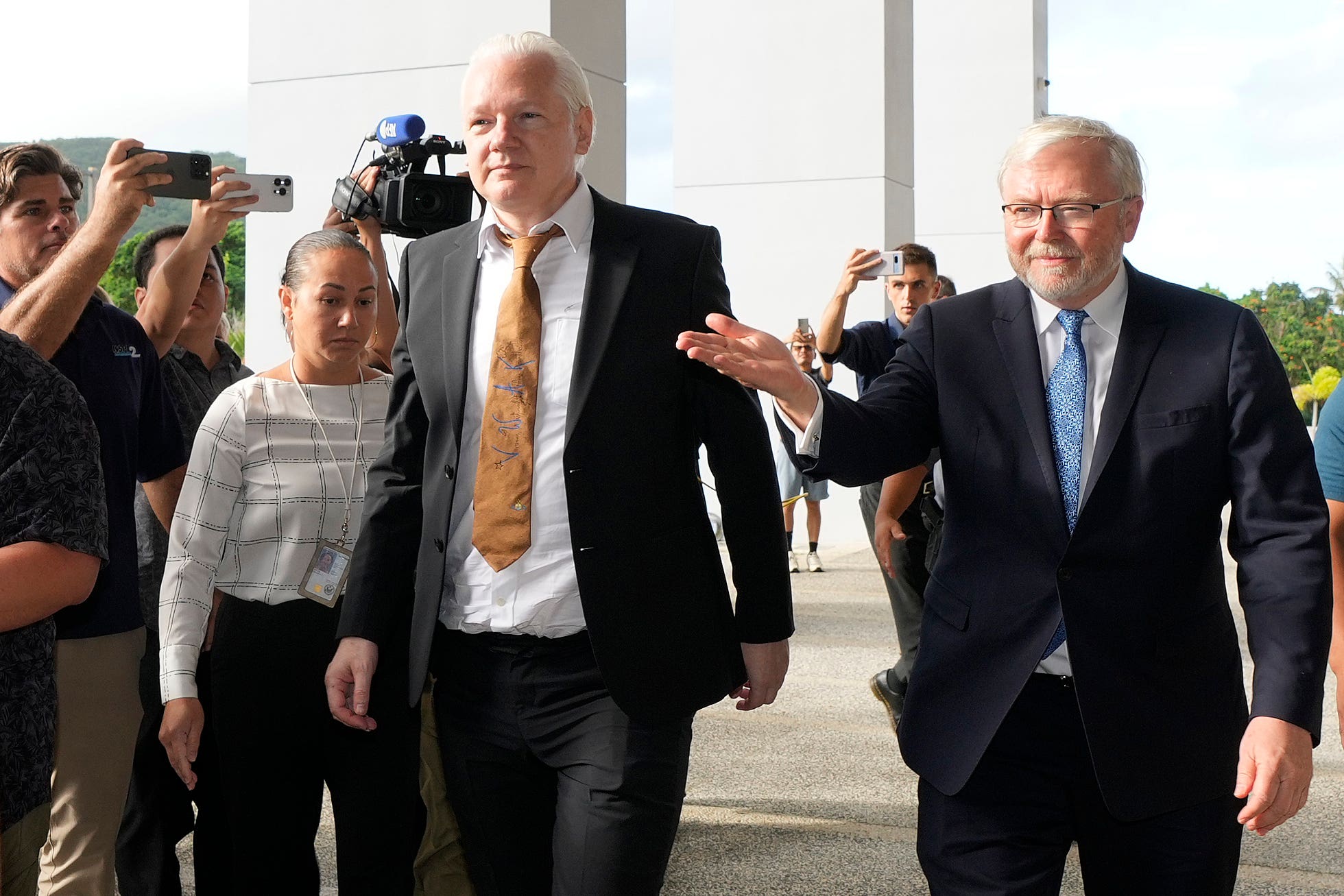 WikiLeaks founder Julian Assange, centre, arrives at the United States courthouse in Saipan, Mariana Islands, Wednesday, June 26, 2024. (AP Photo/Eugene Hoshiko)