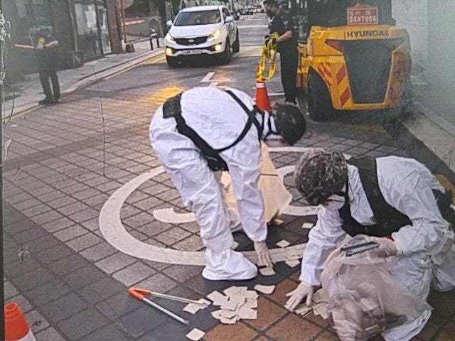 File: South Korean soldiers check a balloon carrying garbage, presumably sent by North Korea