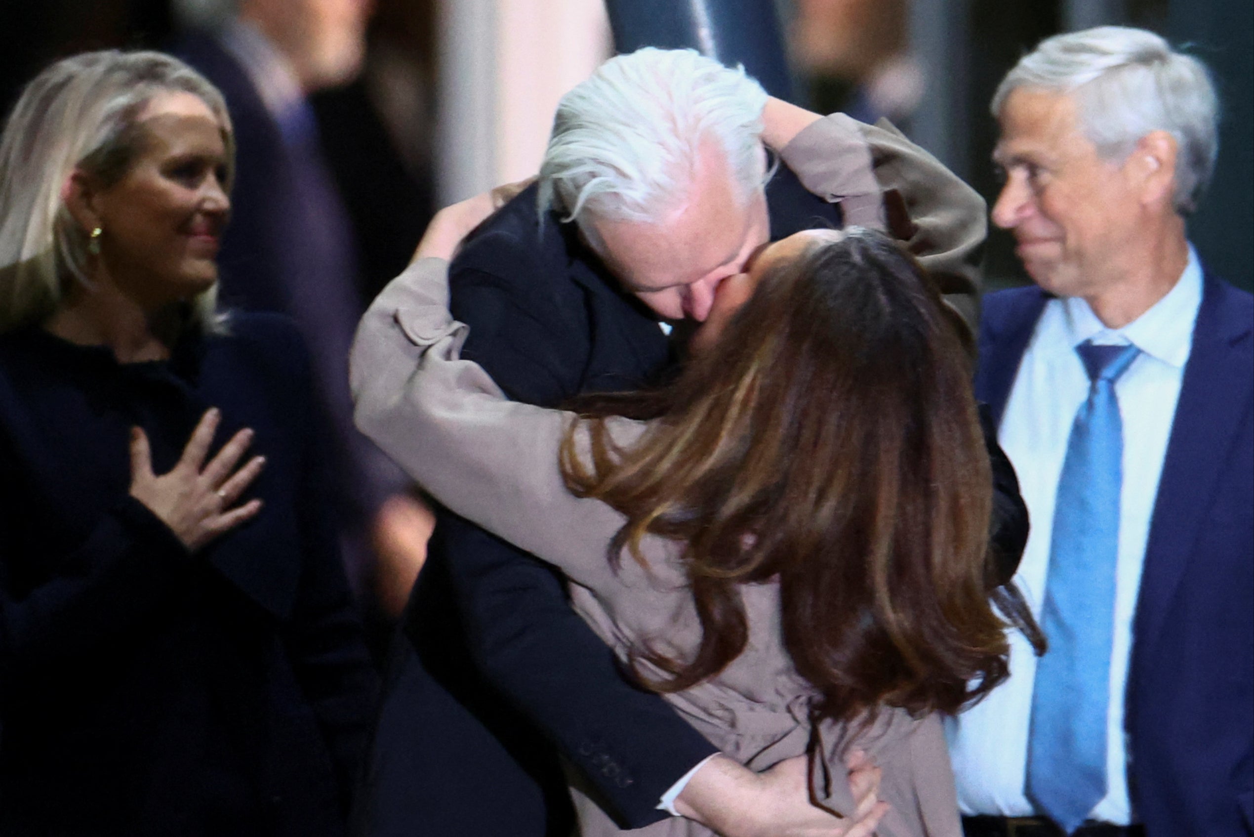 Julian Assange kisses his wife Stella Assange as he arrives in Canberra