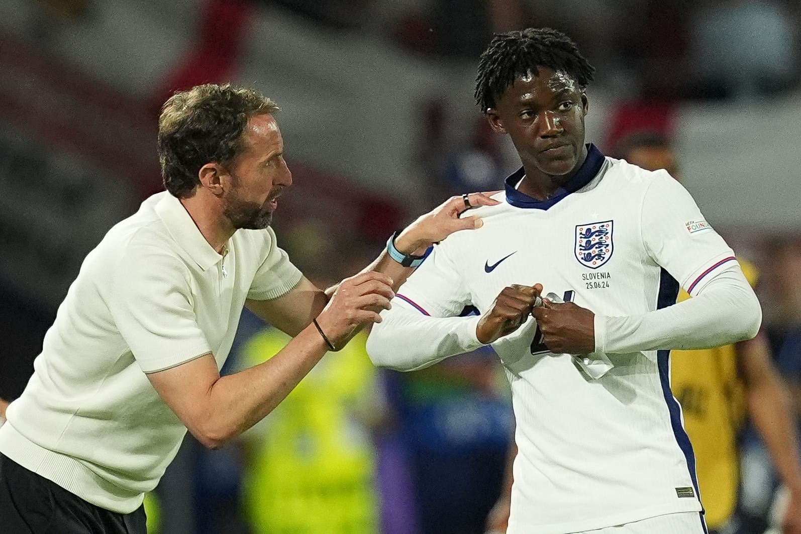 Will England manager Gareth Southgate hand Kobbie Mainoo (right) a start in the next game at Euro 2024? (Martin Rickett/PA)