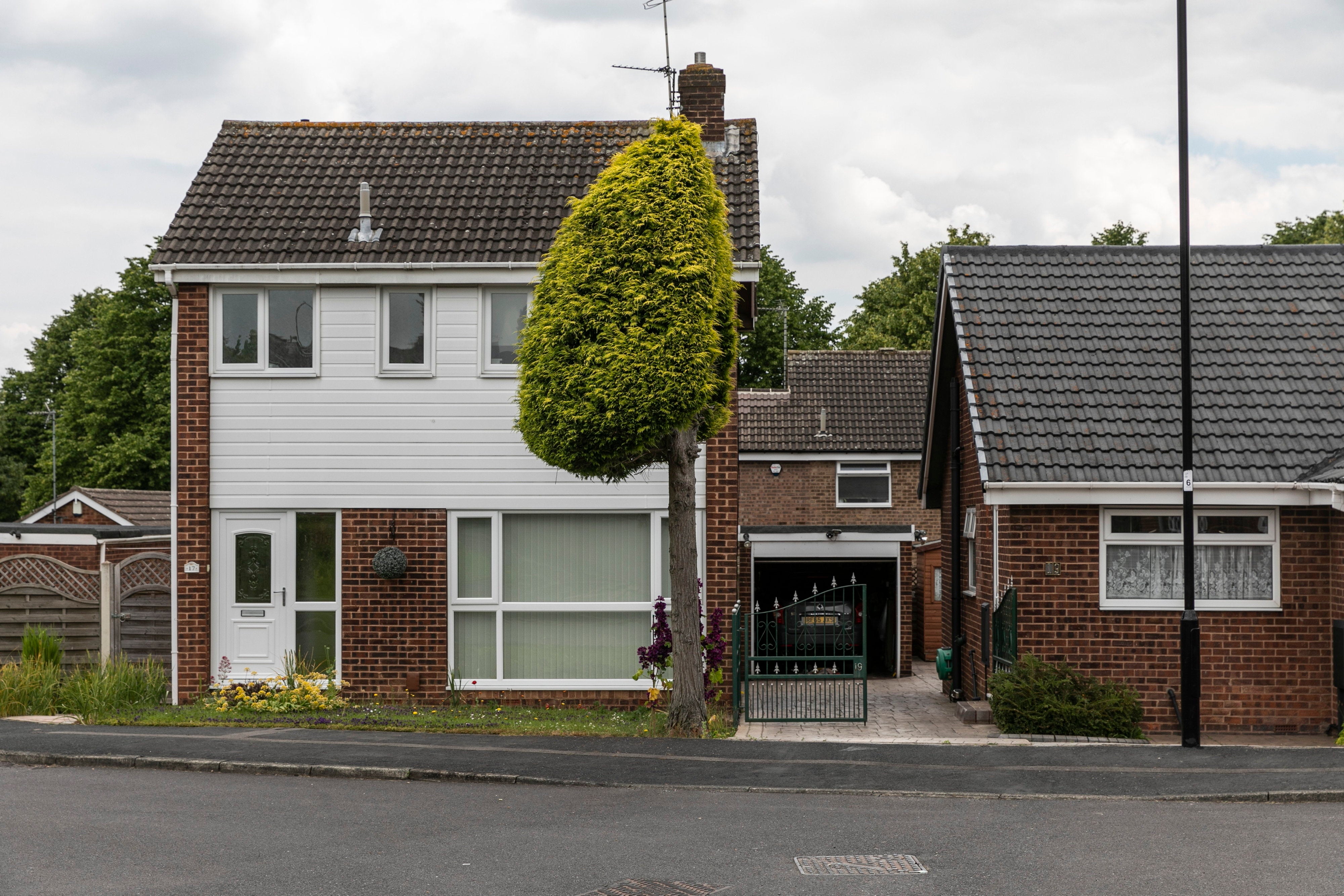 Neighbours who split their tree in three two years ago are still no speaking due to the initial row, pictured in Waterthorpe, Sheffield