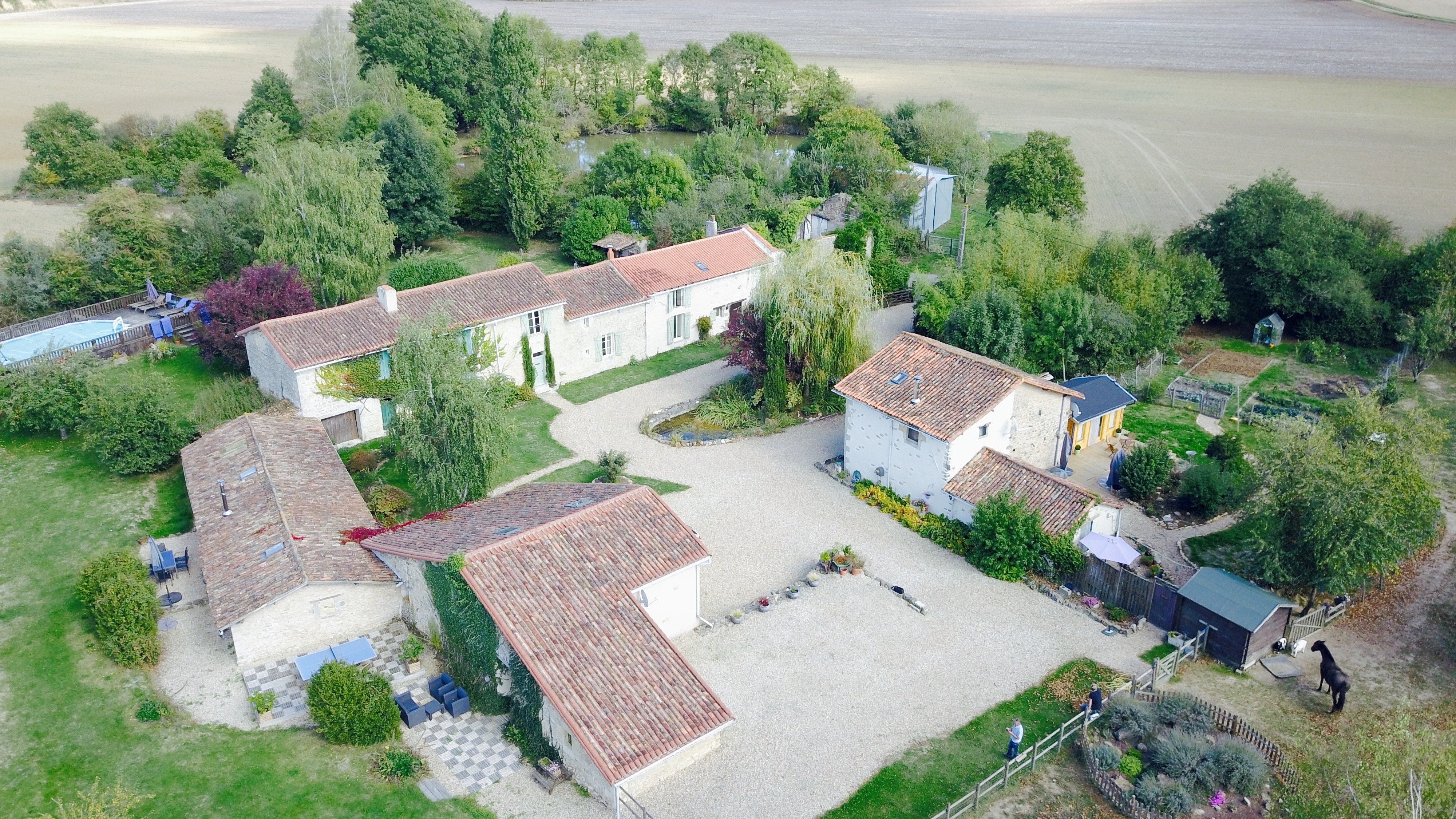 The couple sold their three-bed home in Manchester for £400,000 and used the cash to buy six 400-year-old houses, two barns and three-acres of land