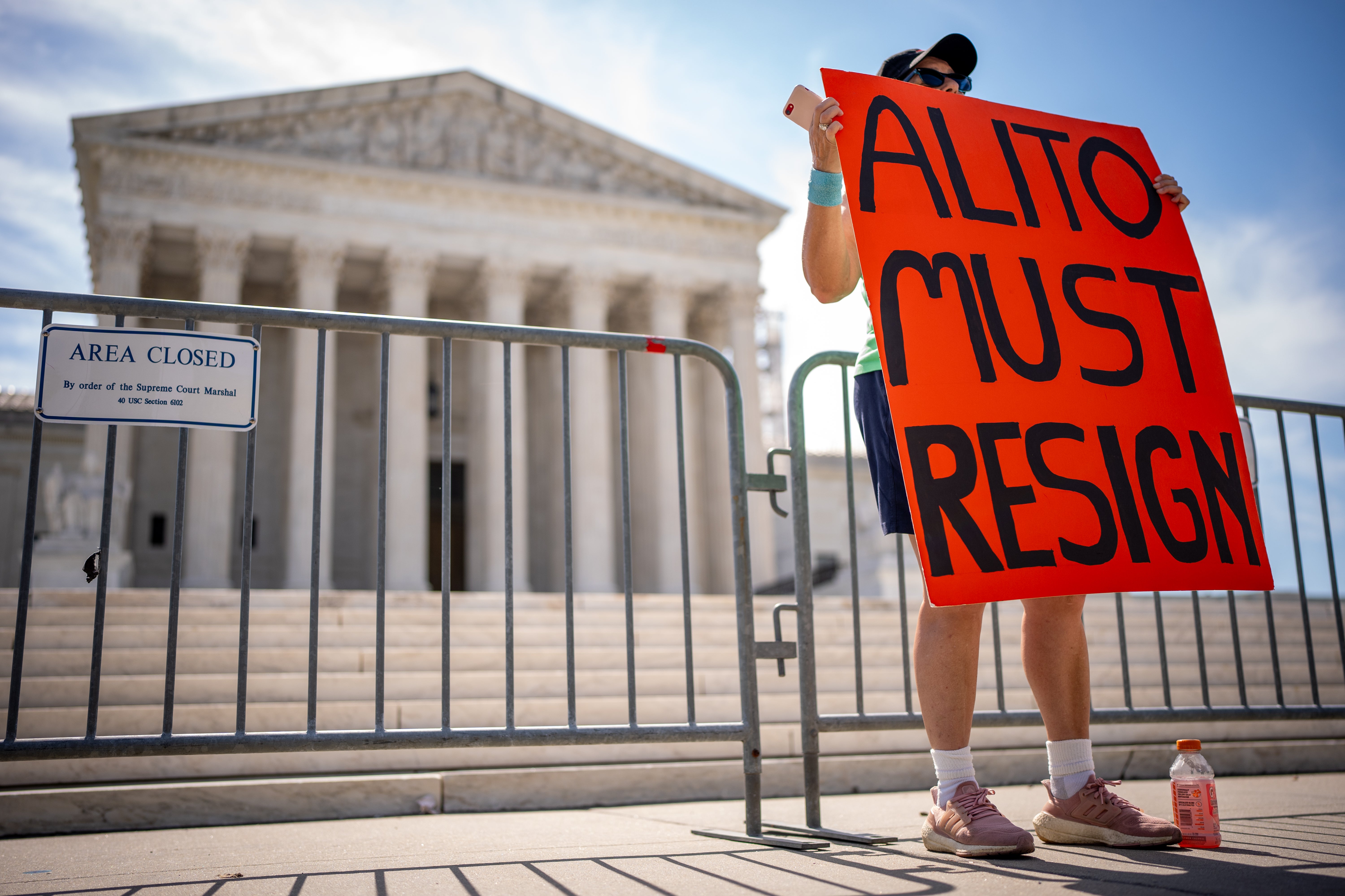 A protester calls for Justice Samuela Alito’s resignation outside the Supreme Court on June 20 after he refused to recuse himself from cases involving Donald Trump and January 6.