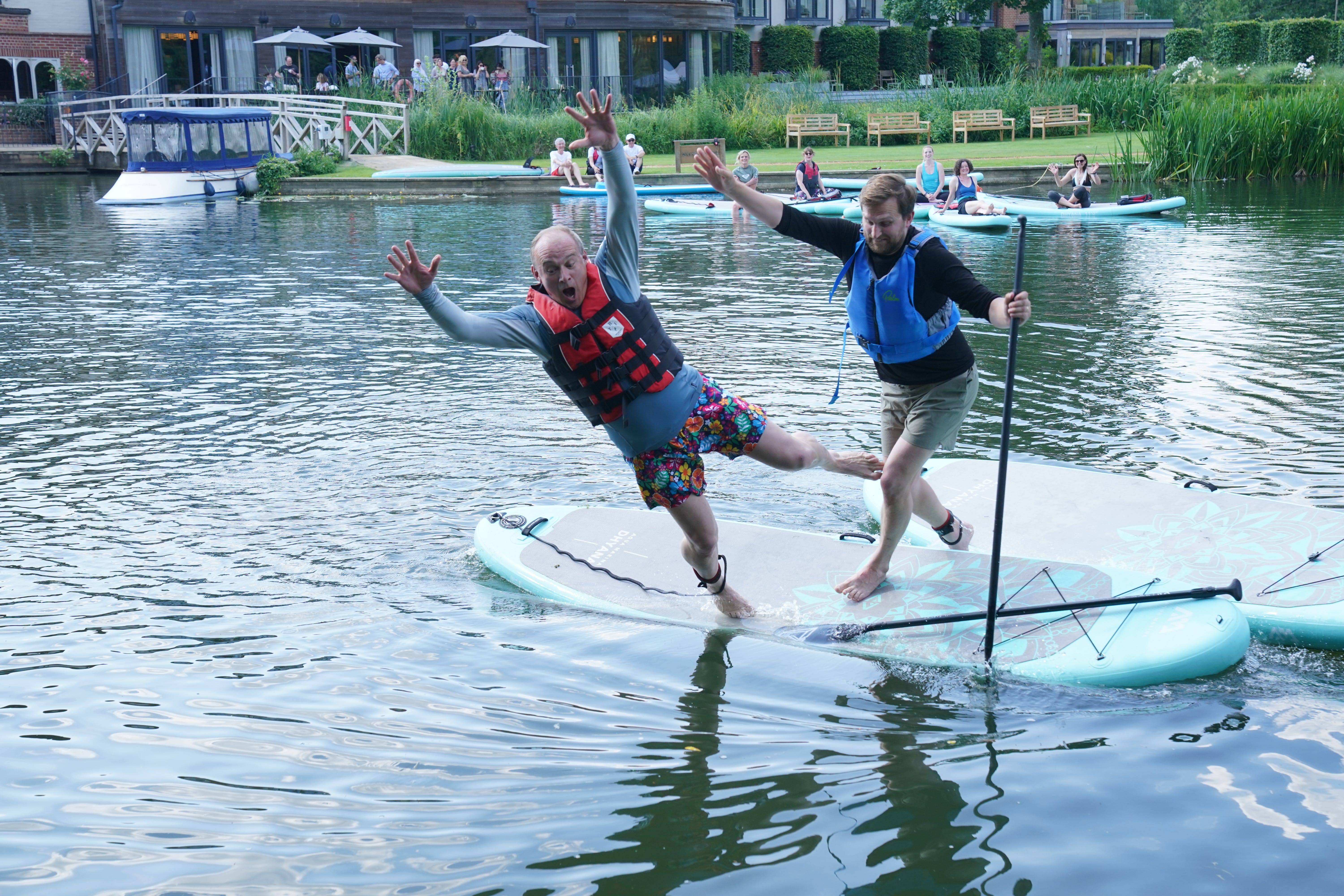 Liberal Democrat leader Sir Ed Davey falls off a paddleboard during his visit to Streatley, Berkshire, while on the General Election campaign trail (Jonathan Brady/PA)