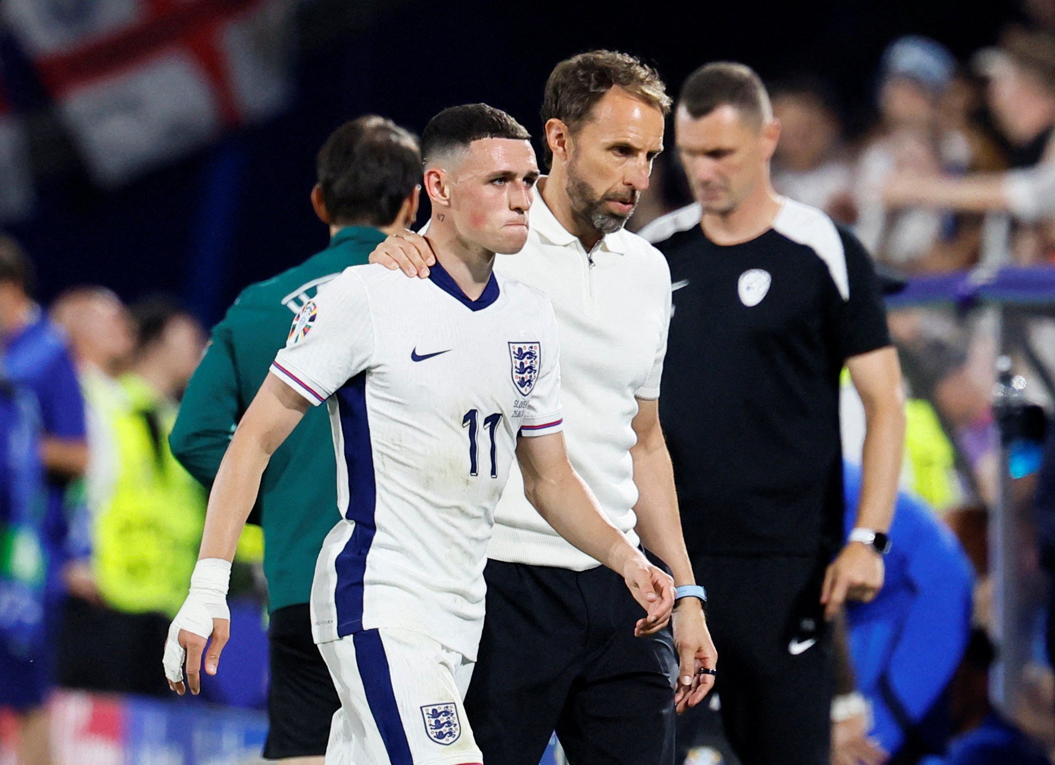 England’s Phil Foden with manager Gareth Southgate after being substituted against Slovenia