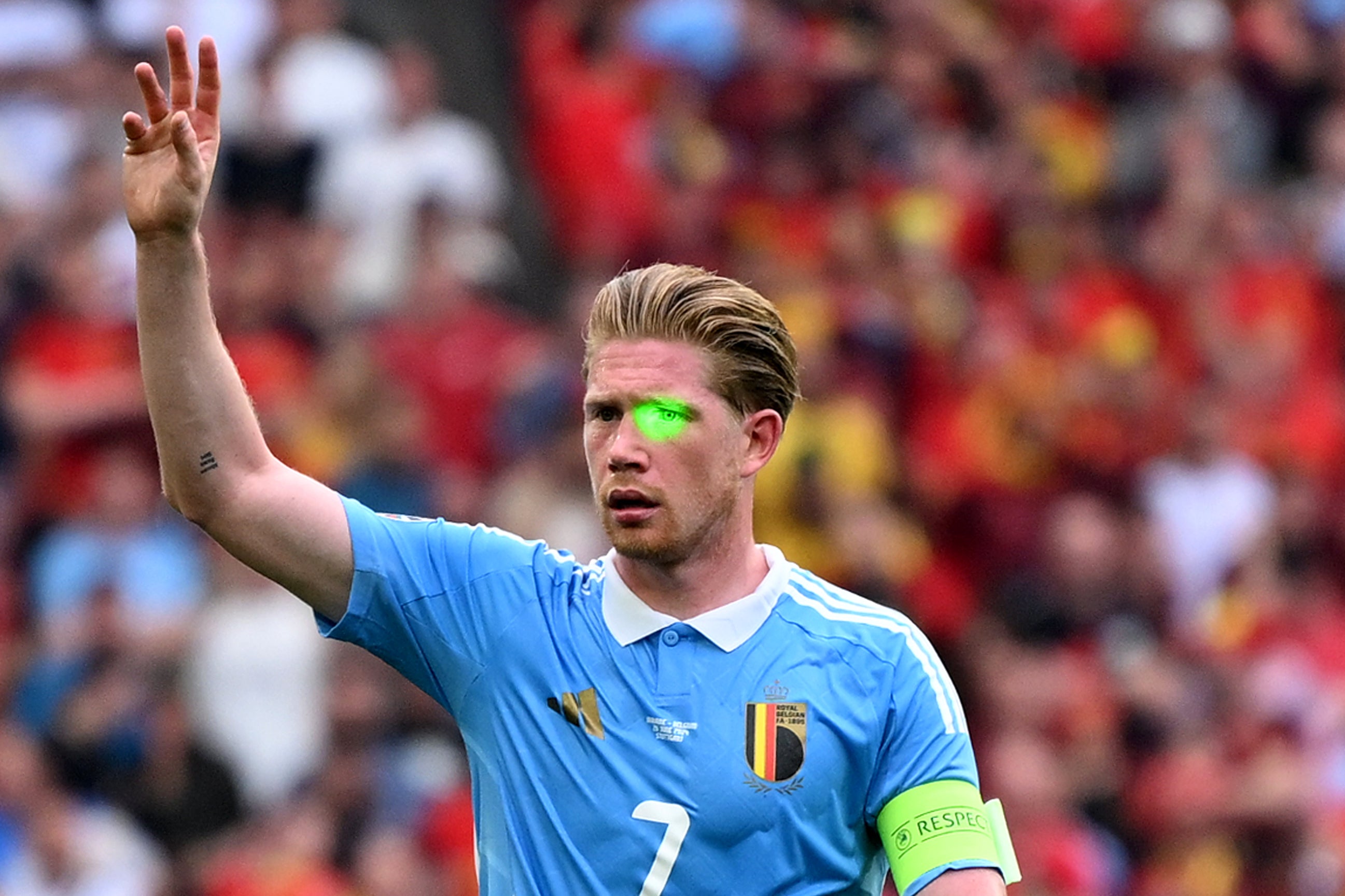 Kevin De Bruyne is distracted by a laser pointer in Belgium’s draw with Ukraine