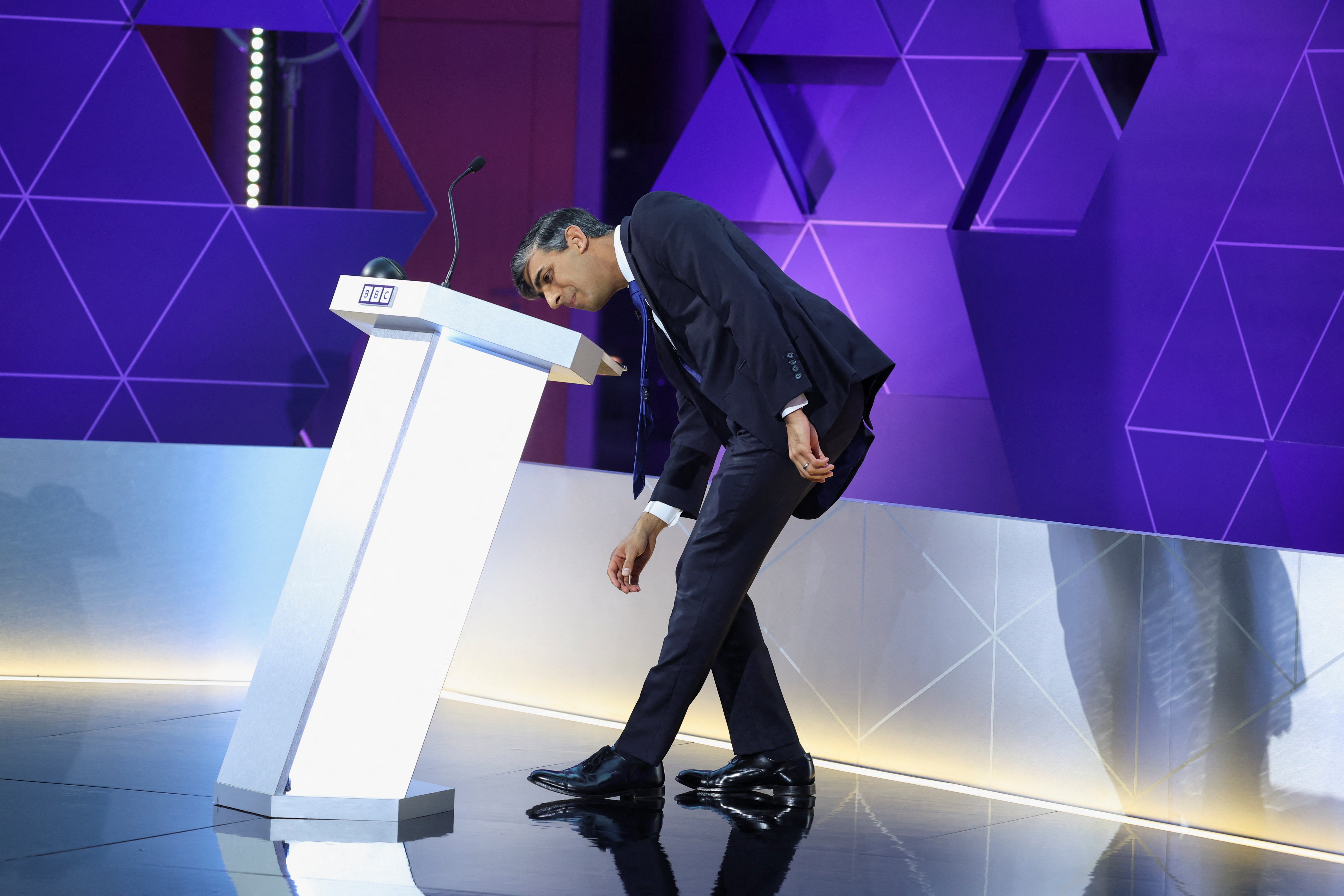 Rishi Sunak, whose upperlip was glistening with sweat throughout the debate, looked for a much-needed glass of water